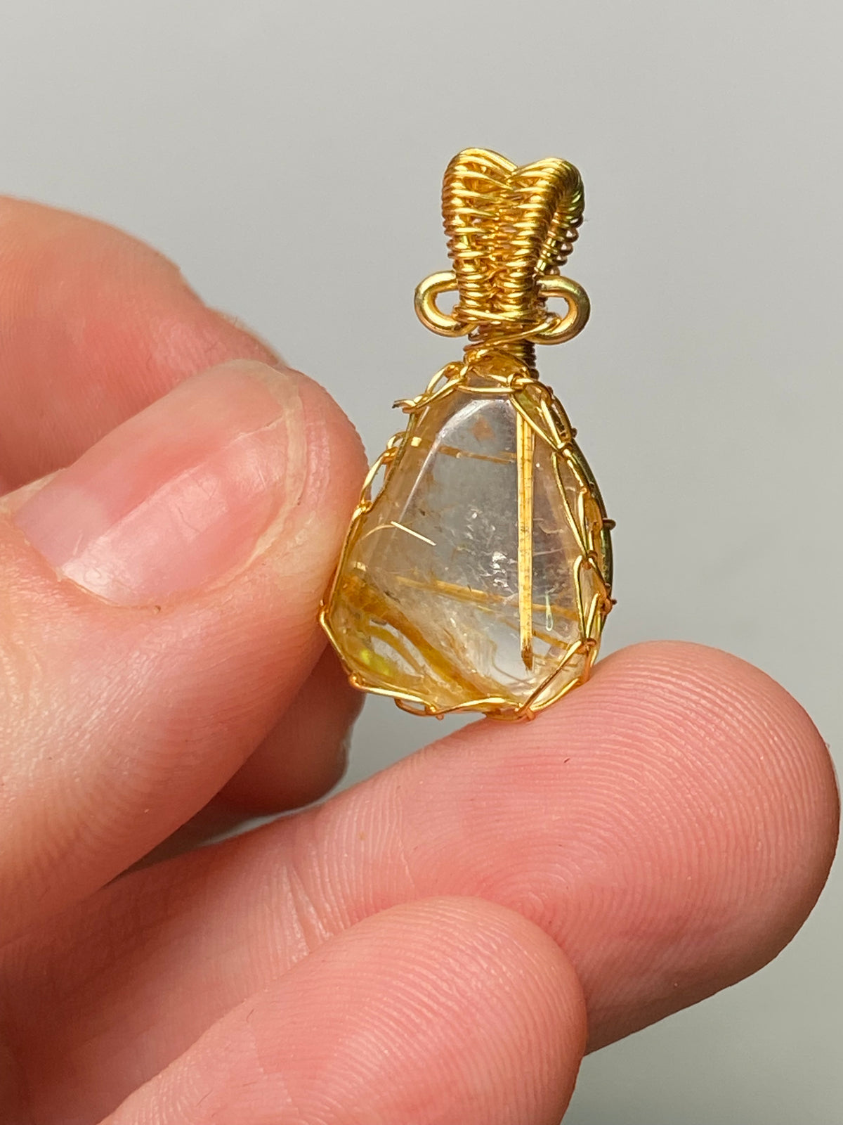 Golden rutile crystal wire wrapped pendant