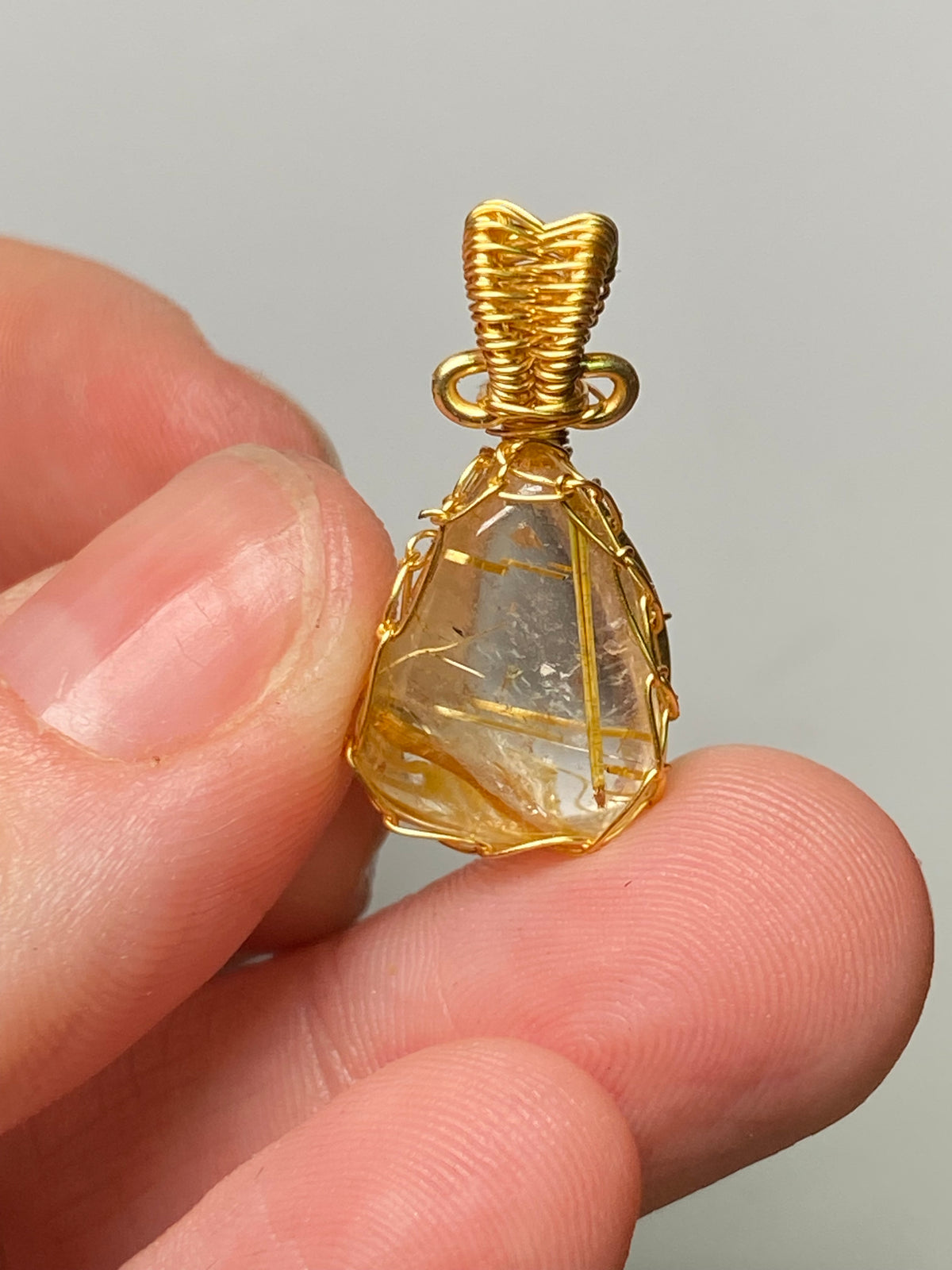 Golden rutile crystal wire wrapped pendant