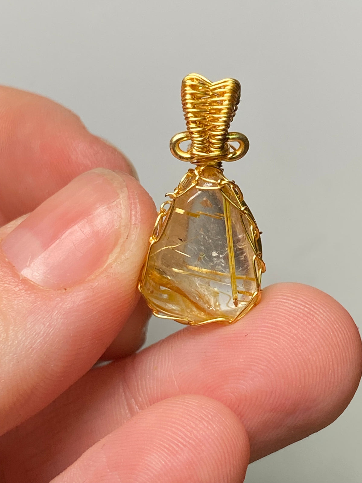 Golden rutile crystal wire wrapped pendant
