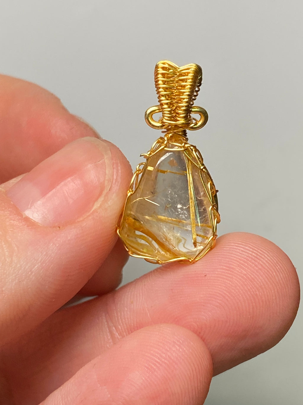 Golden rutile crystal wire wrapped pendant