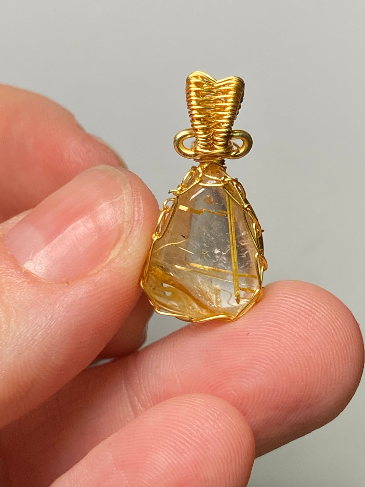 Golden rutile crystal wire wrapped pendant