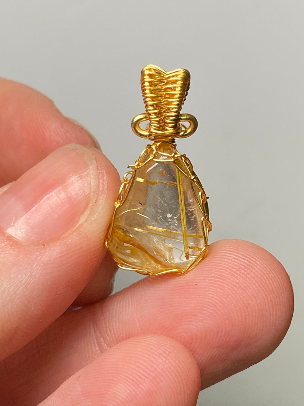 Golden rutile crystal wire wrapped pendant