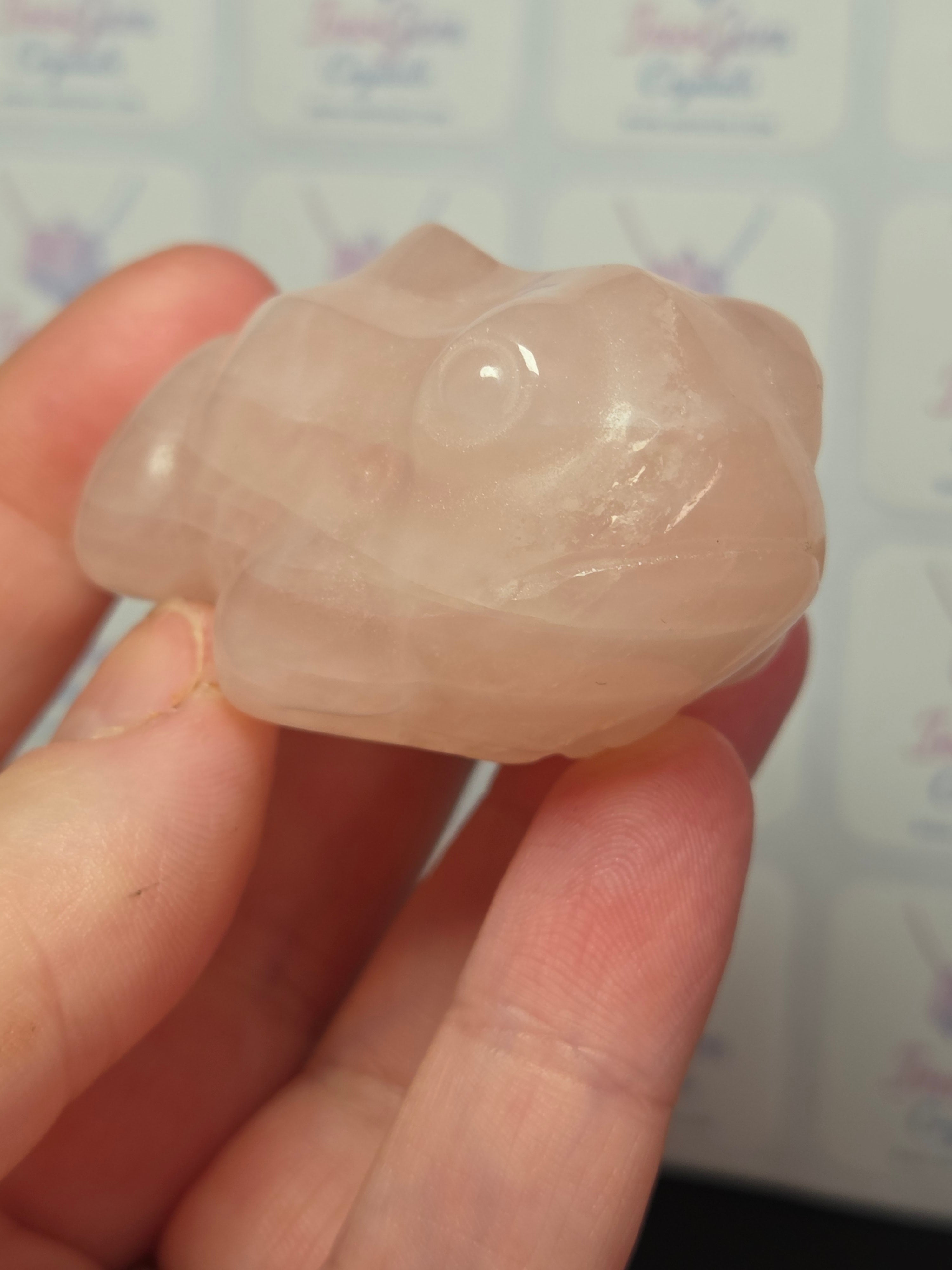 Rose quartz crystal frog carving