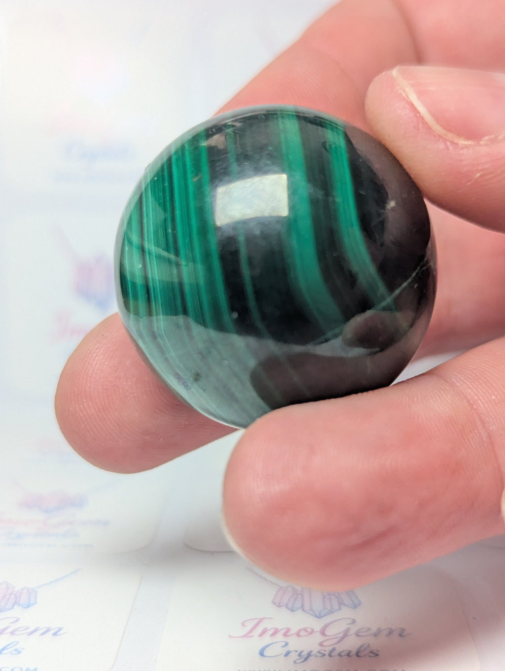 Malicite crystal sphere with imperfections