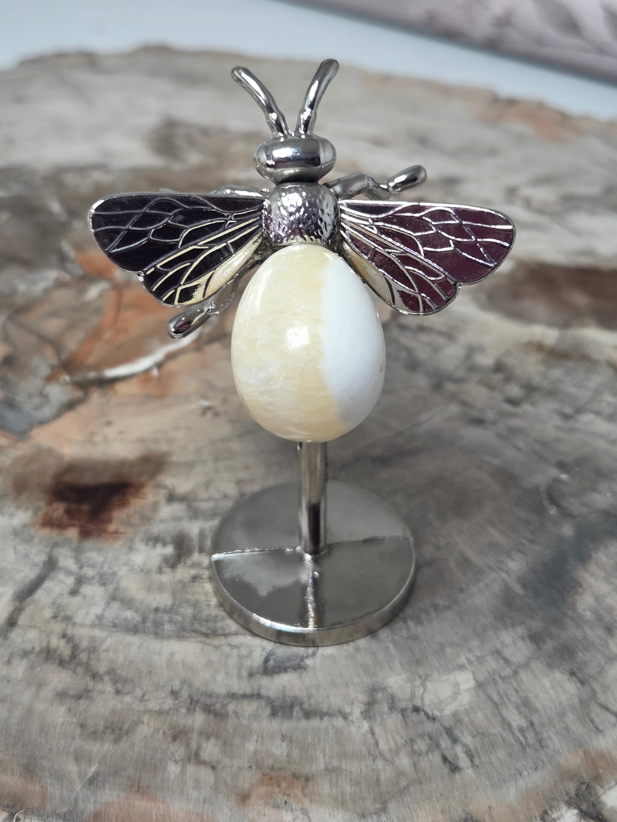 Orange calcite crystal bee carving