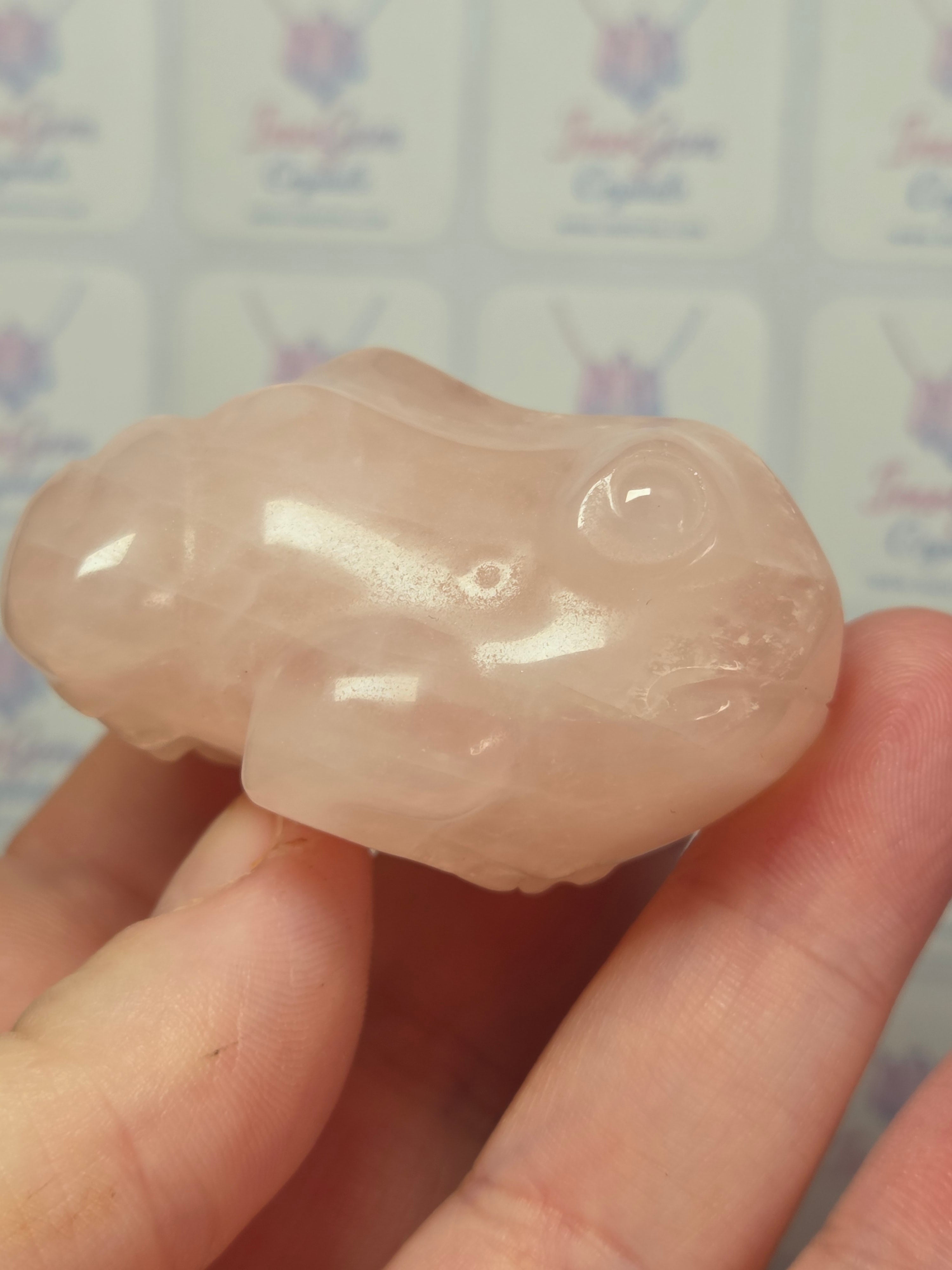 Rose quartz crystal frog carving