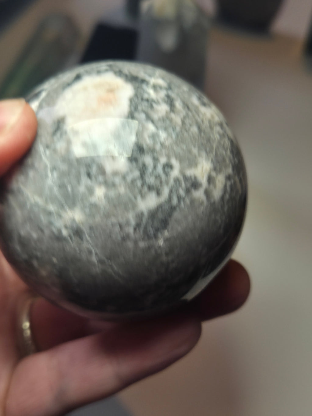 Pink rhodonite crystal sphere