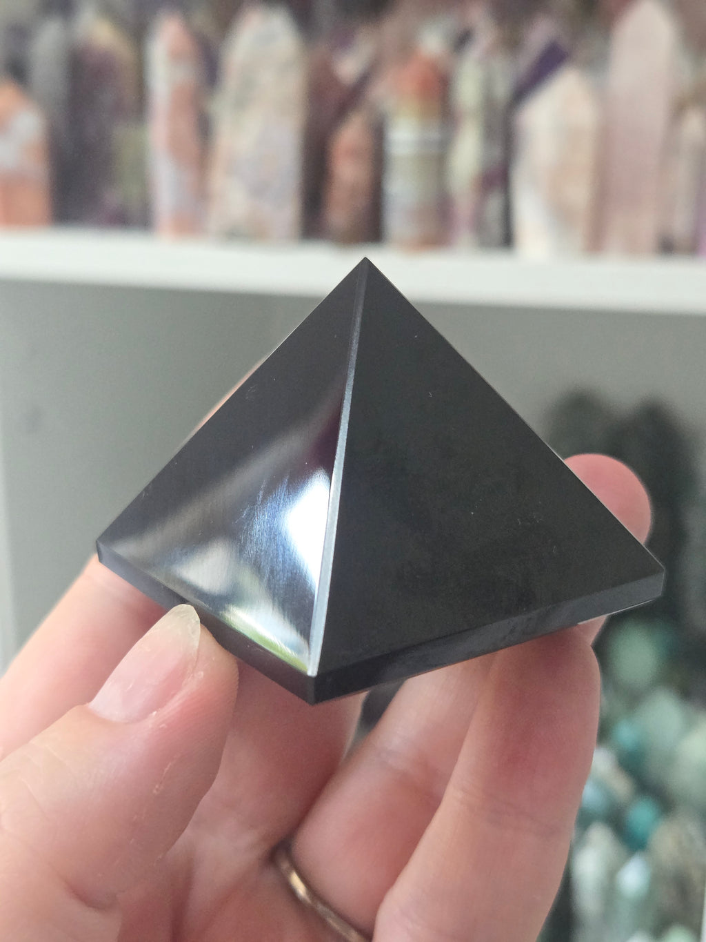 Black obsidian crystal pyramid carving