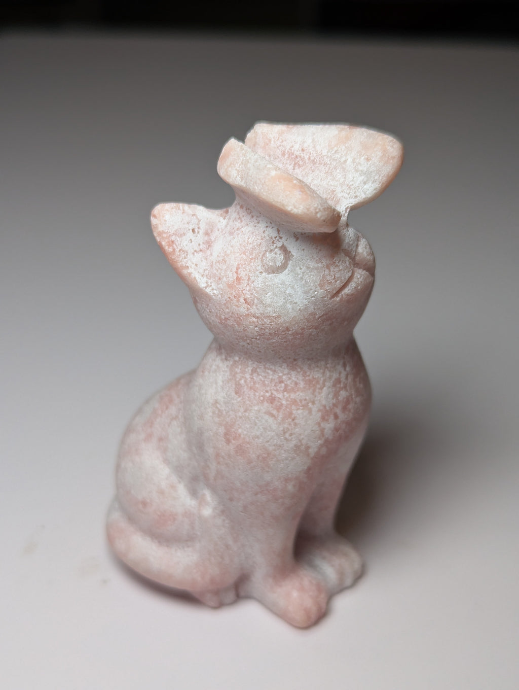 Pink opal cat with butterfly carving