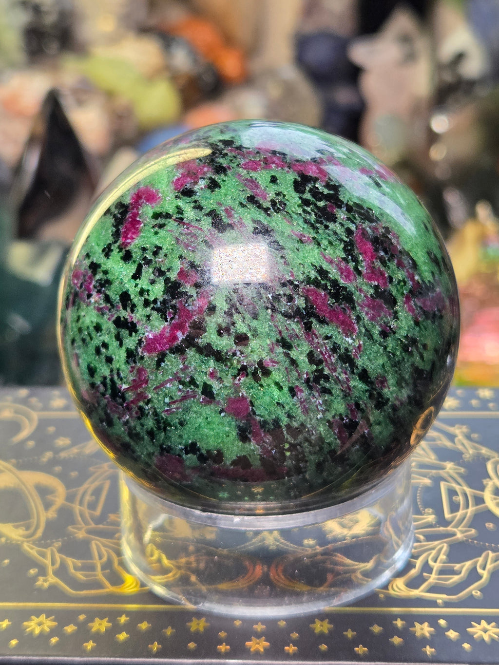 Ruby in zoisite crystal sphere carving