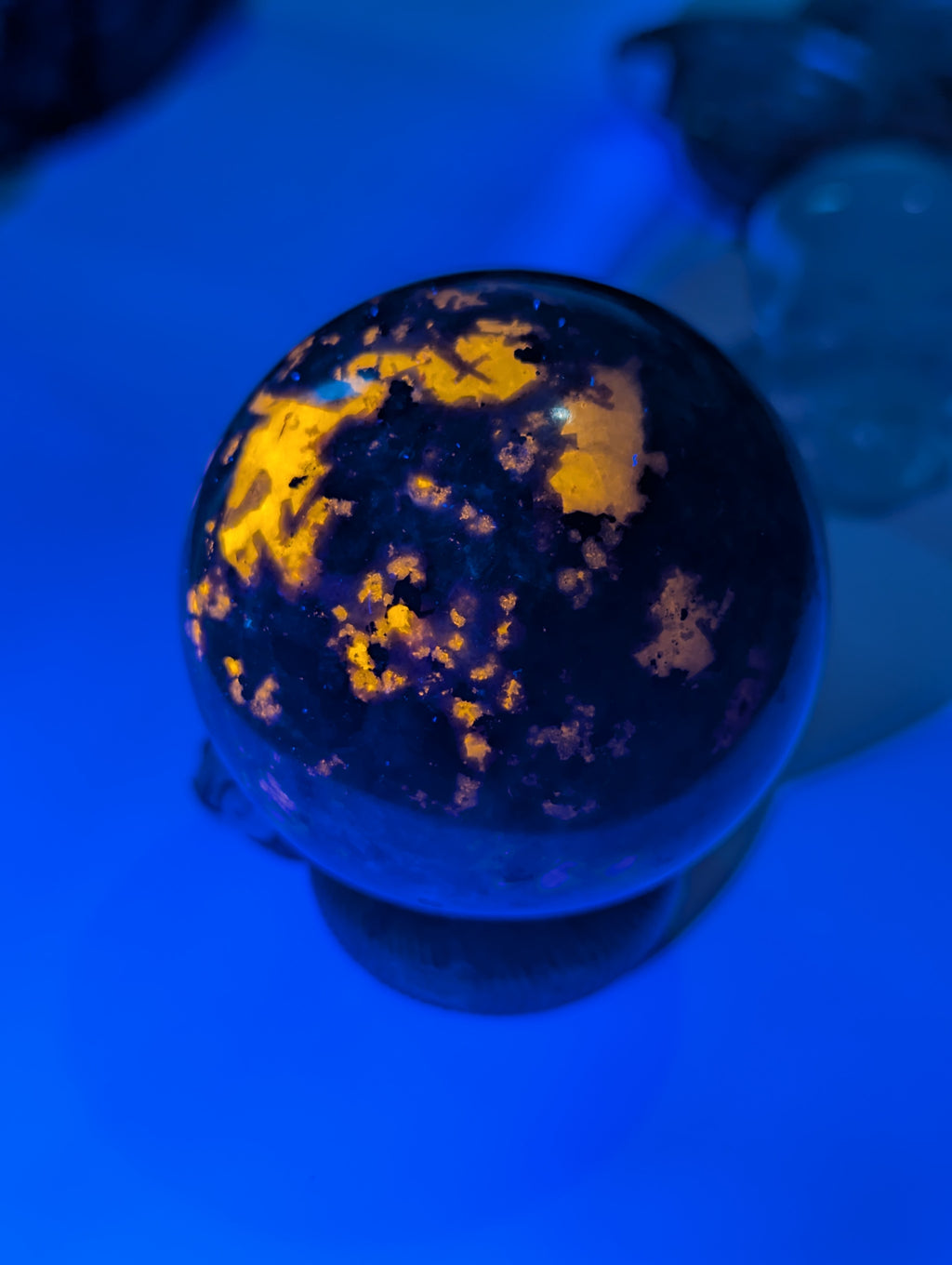 Yooperlite crystal sphere with Orange UV