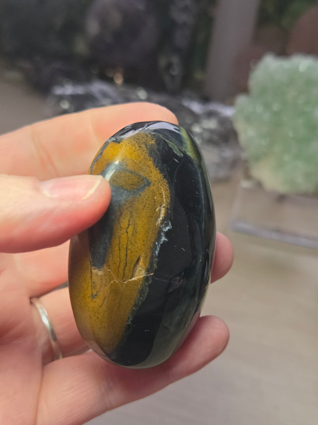 Tigers eye palm stone with Imperfections