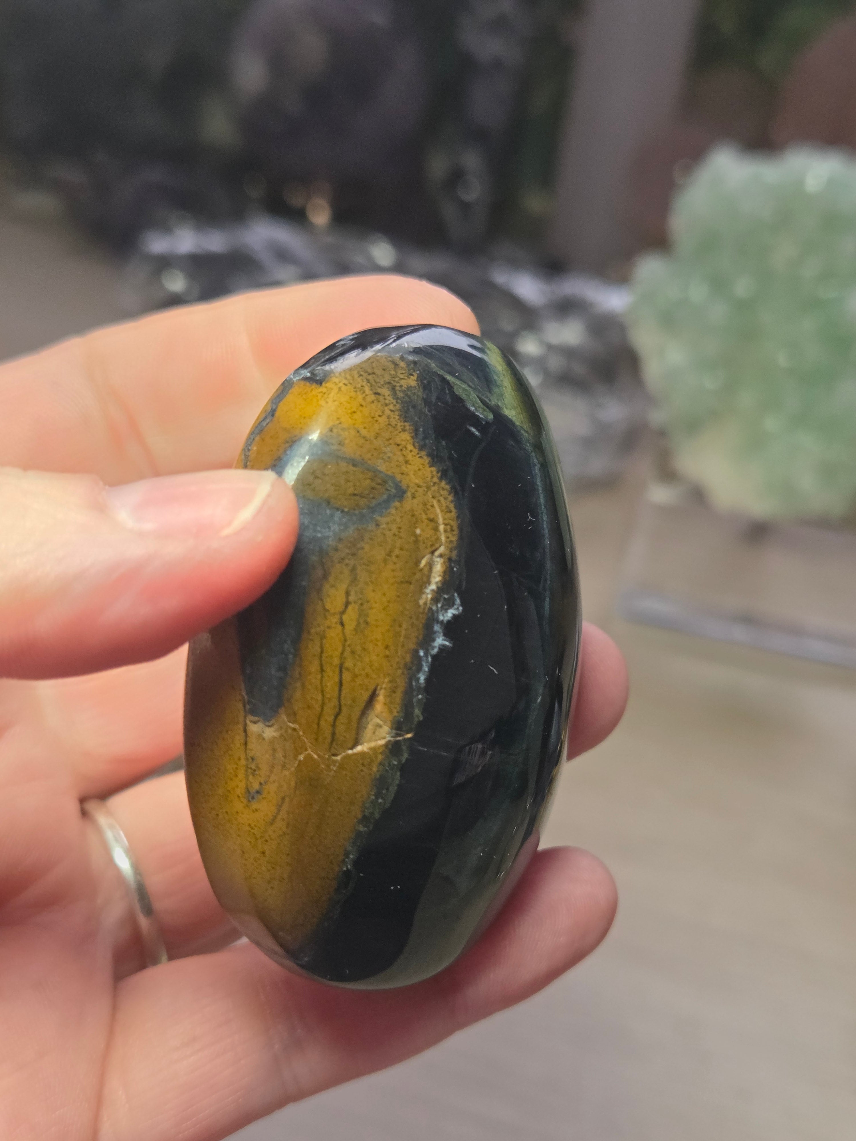 Tigers eye palm stone with Imperfections