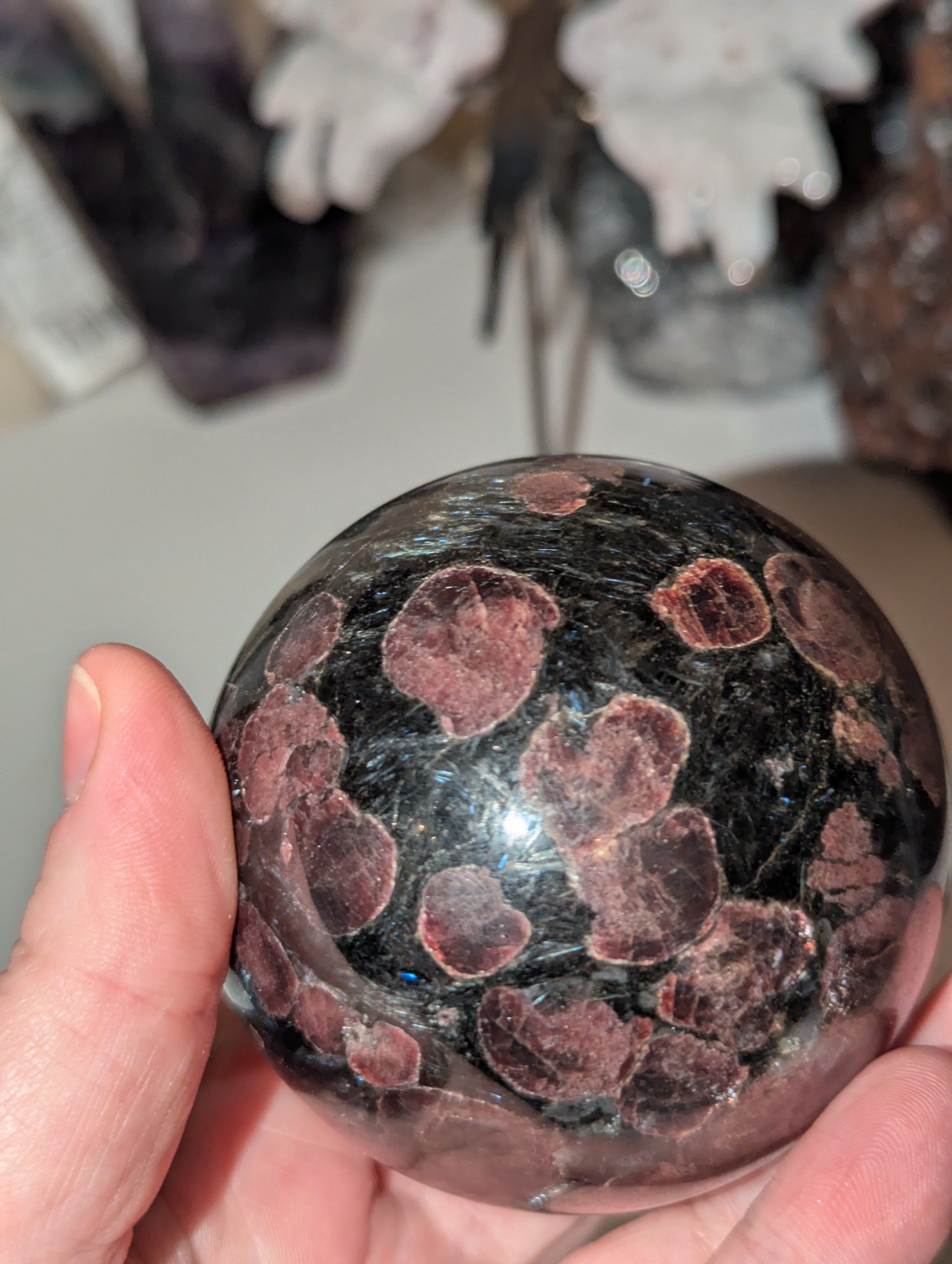 Astrophylite crystal sphere with garnet