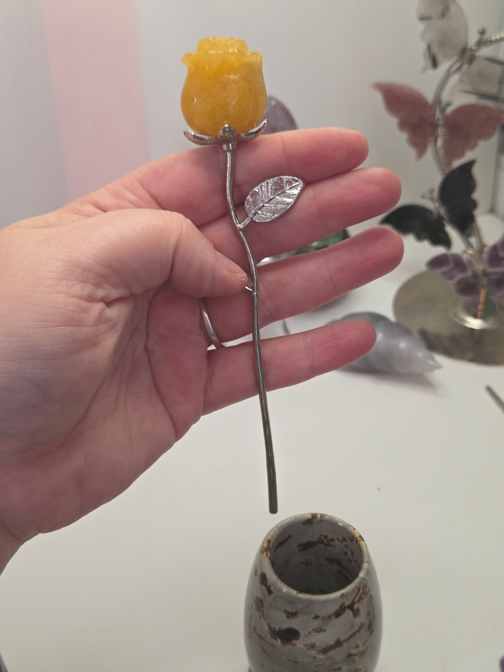 Golden healer crystal rose carving on a stem