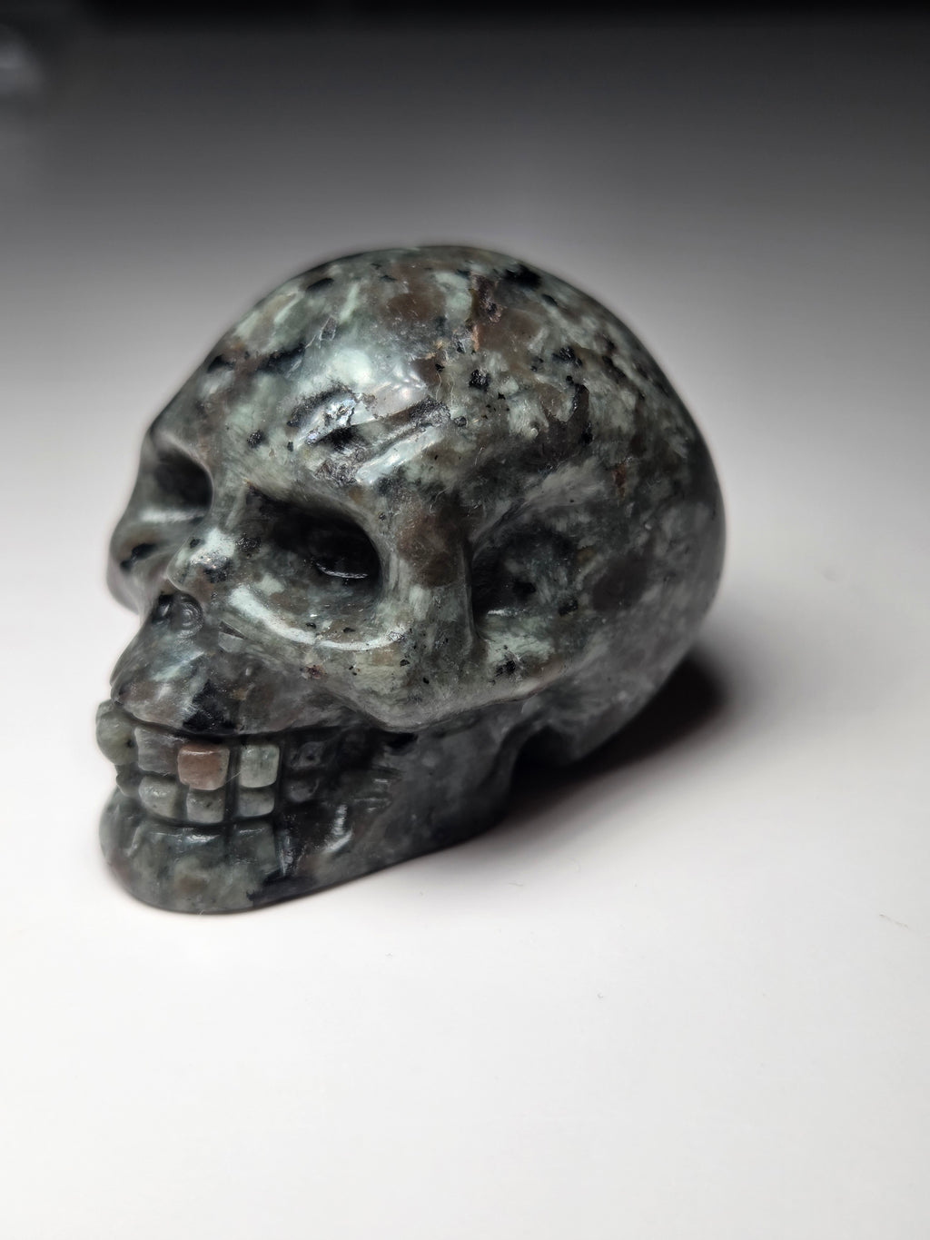 Small Yooperlite crystal skull carving