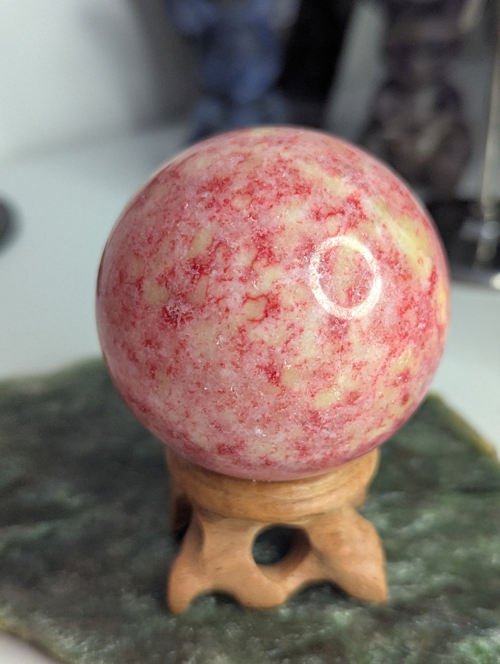 Pink Zoiltie crystal sphere with Orange UV