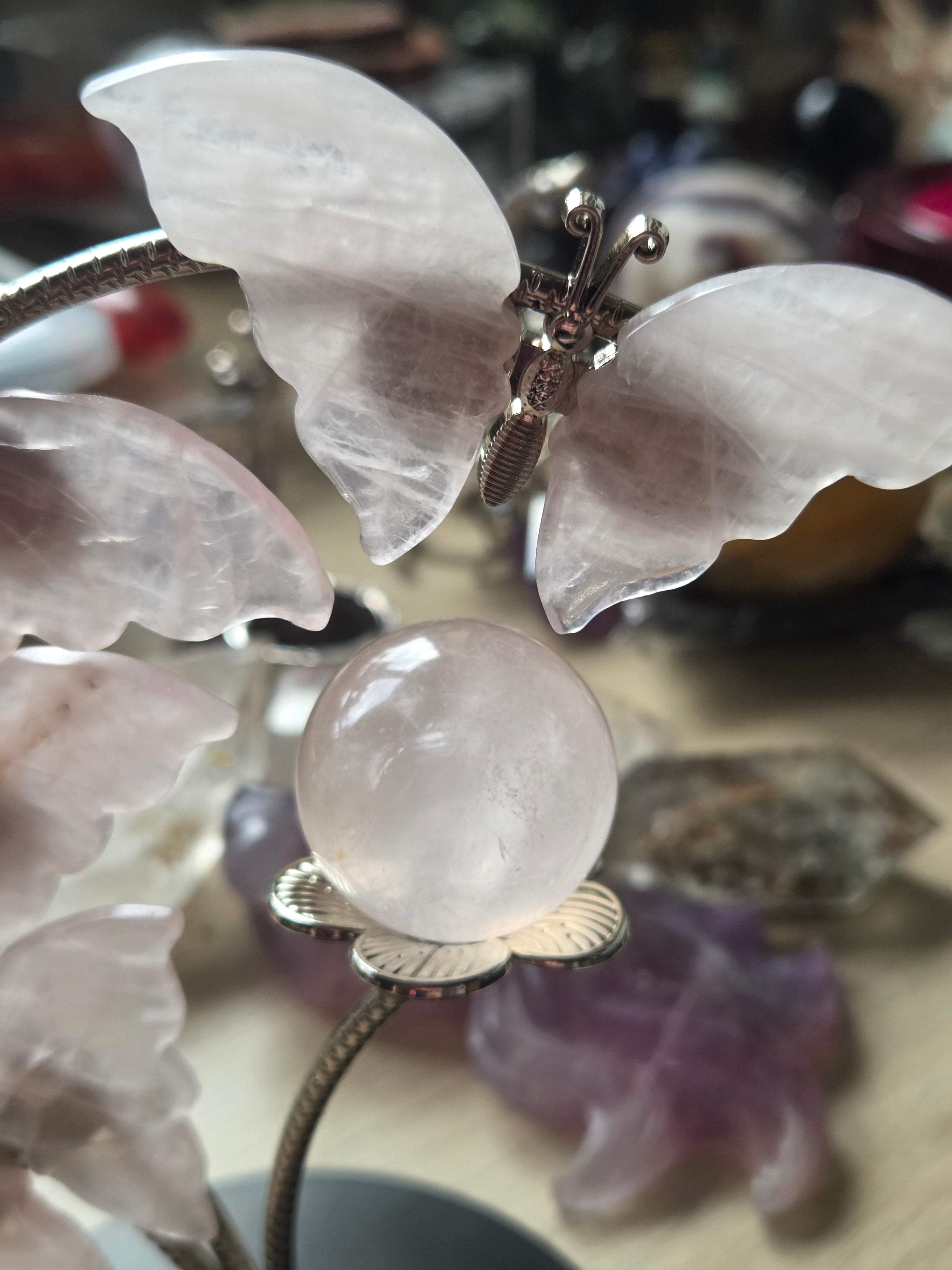 Rose quartz crystal sphere and  butterfly stand