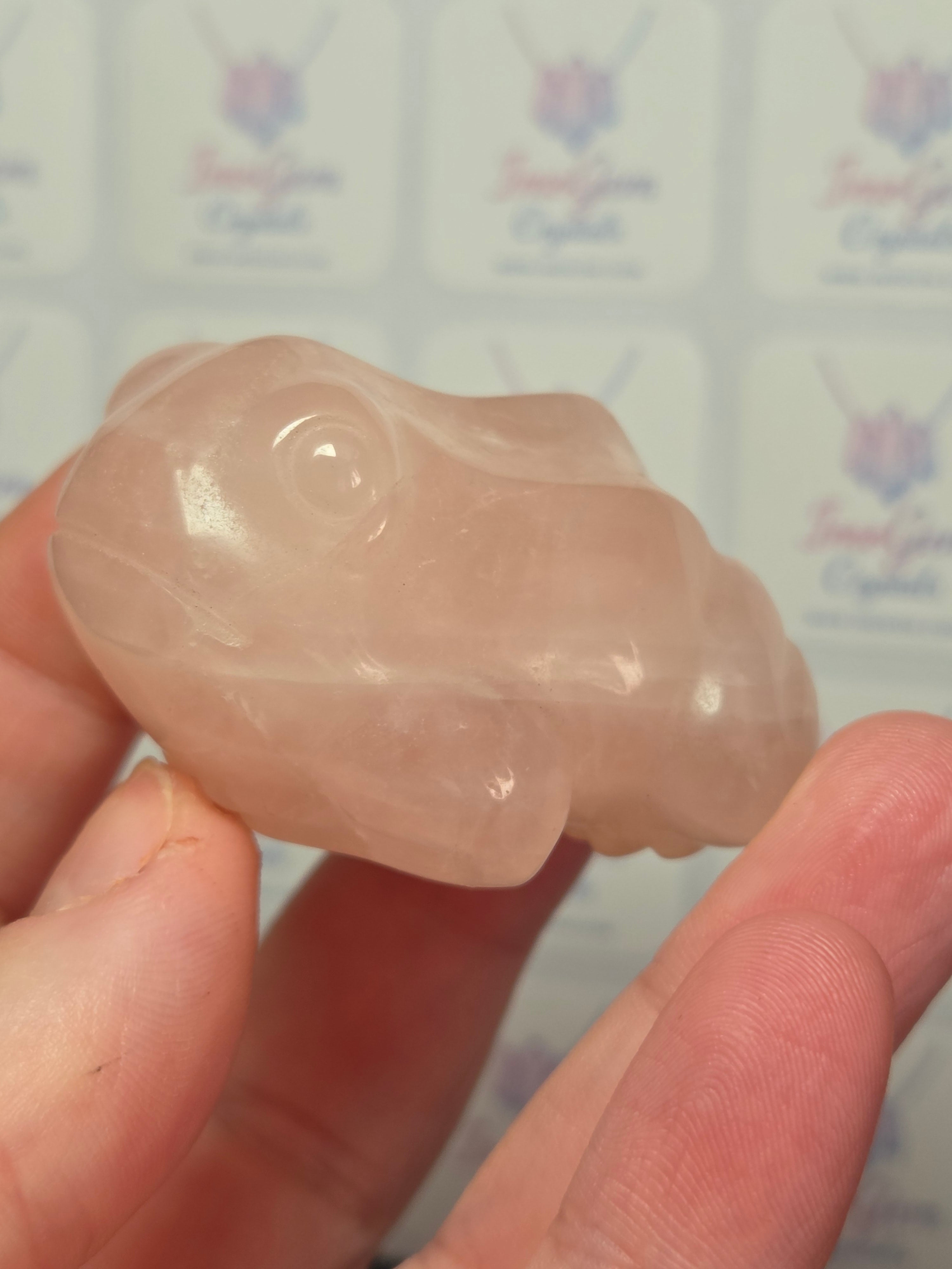 Rose quartz crystal frog carving