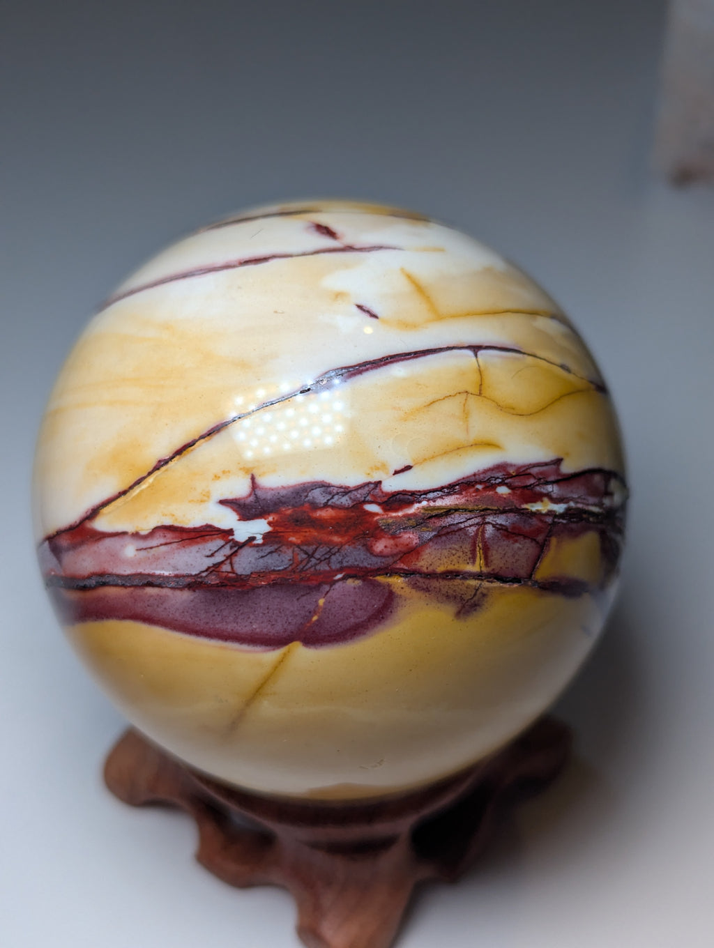 Mookaite crystal sphere with stand