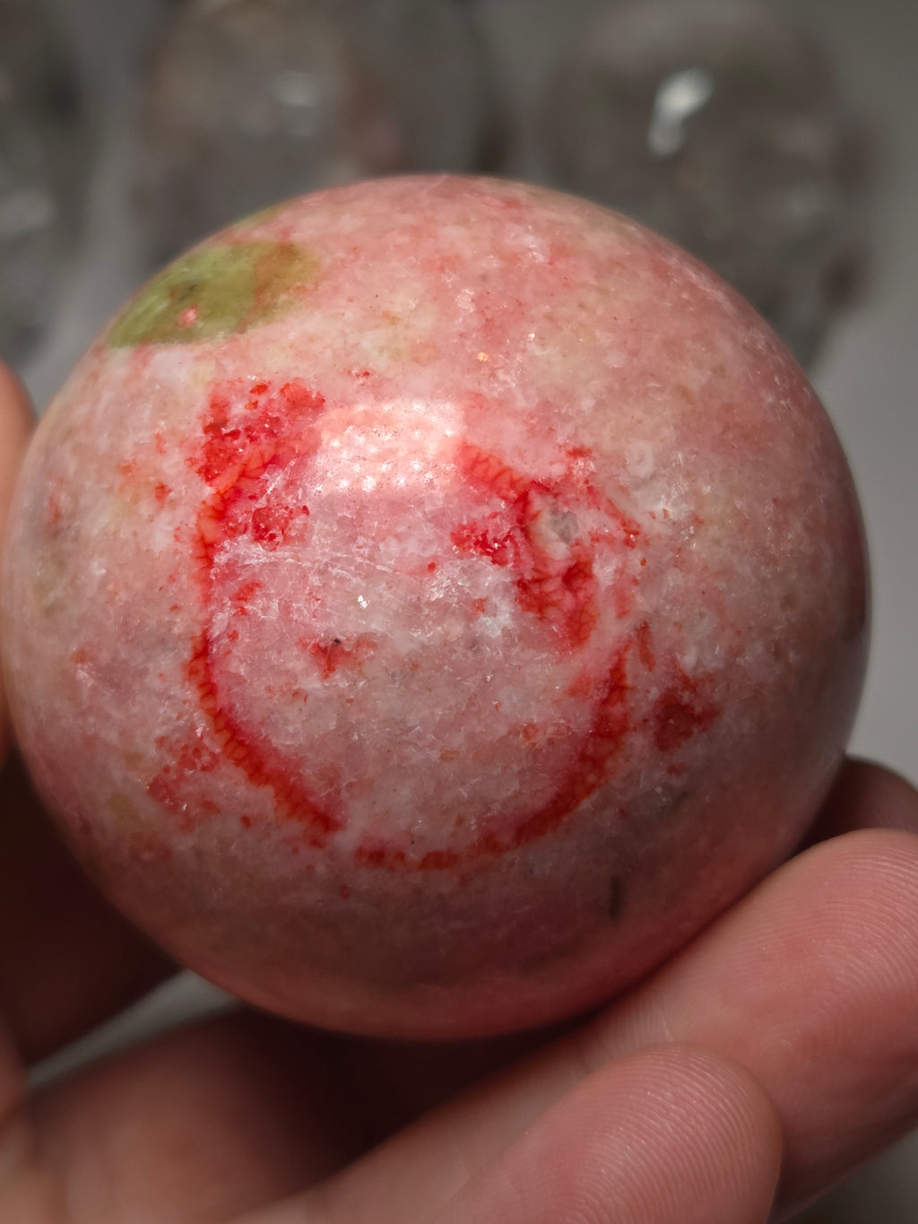 Pink zoisite crystal sphere carving with UV and comes with Stand