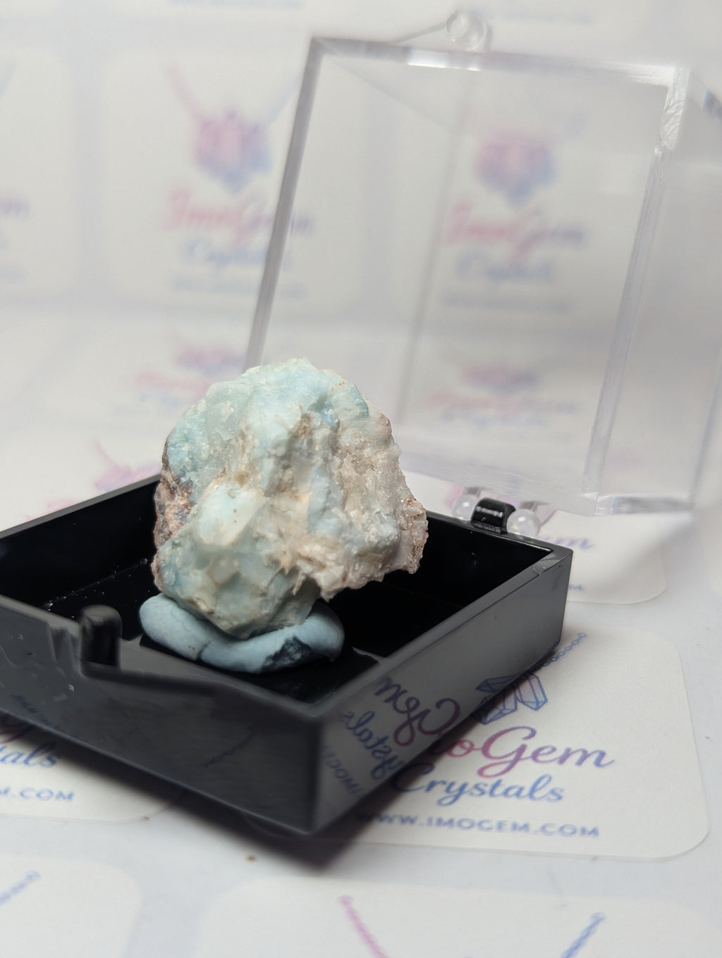Raw Larimar crystal specimen with box