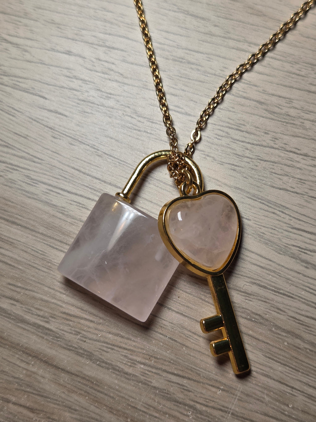Rose quartz crystal key and log necklace