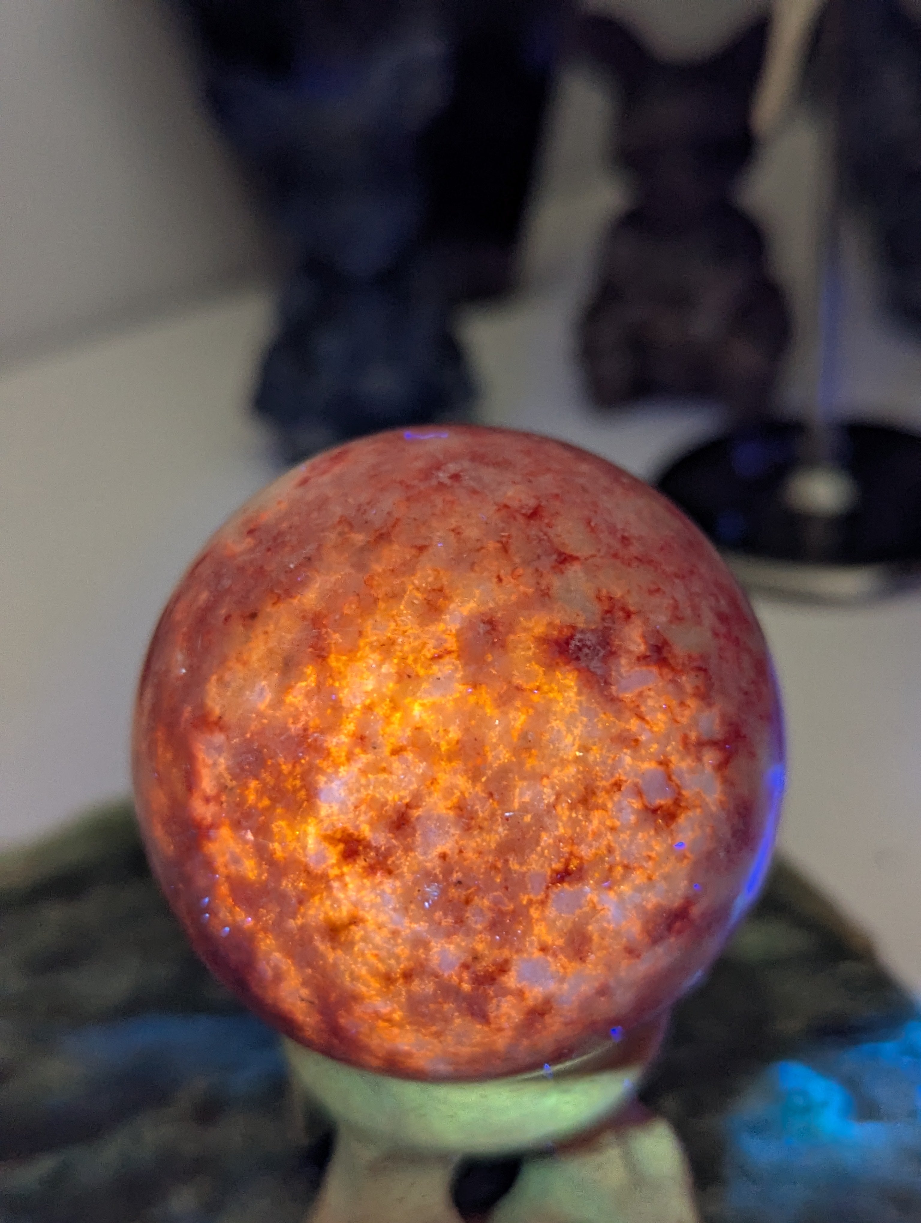 Pink Zoiltie crystal sphere with Orange UV