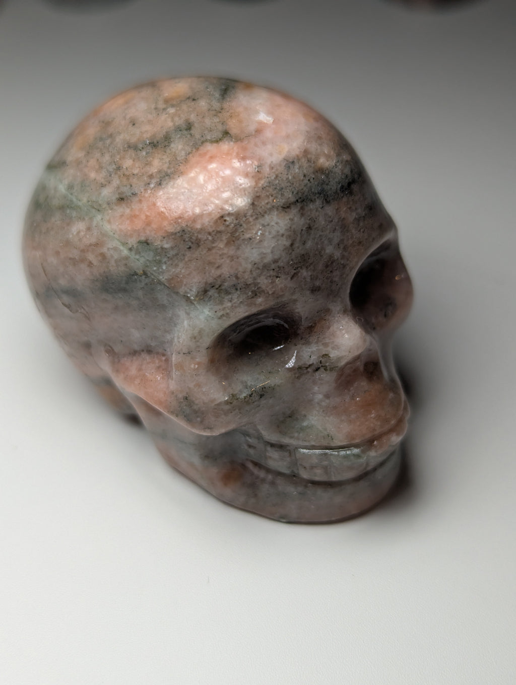 Sunstone crystal skull carving