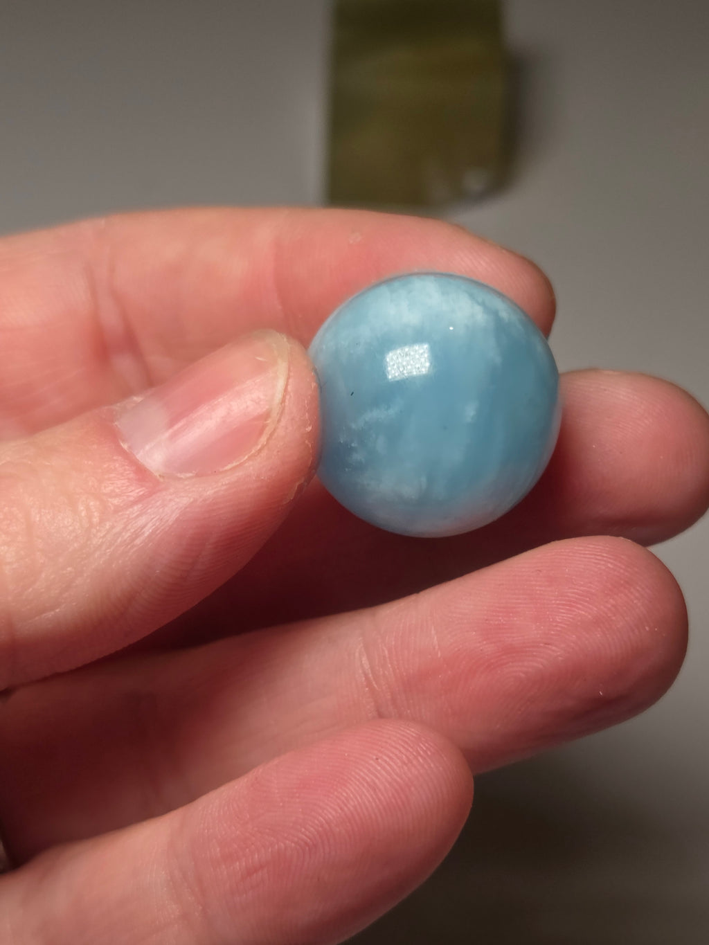 Aquamarine crystal sphere with stand