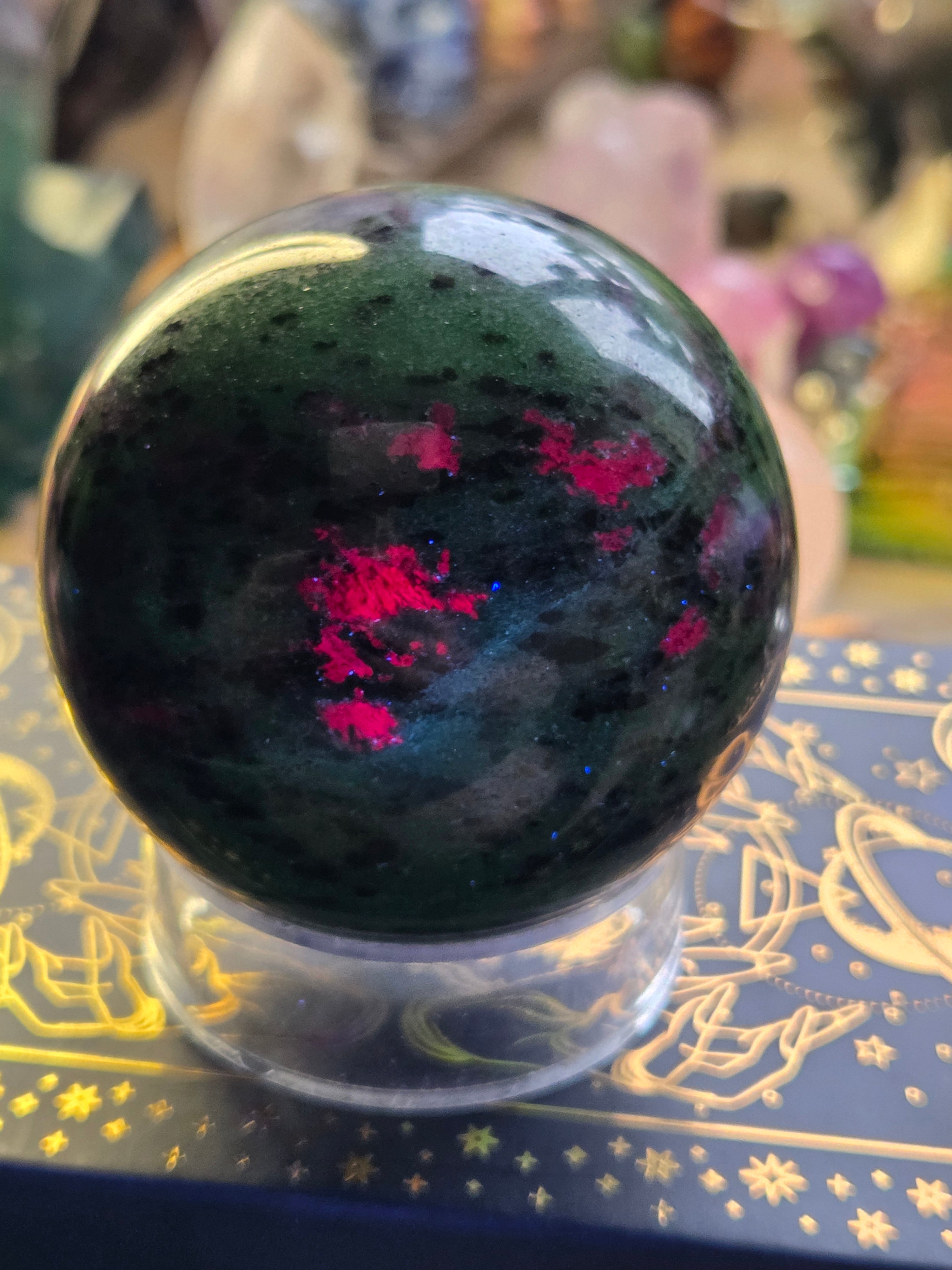 Ruby in zoisite crystal sphere carving