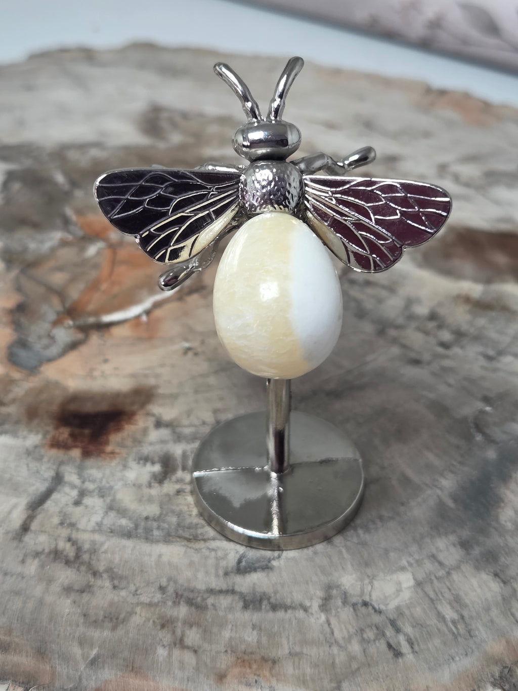 Orange calcite crystal bee carving