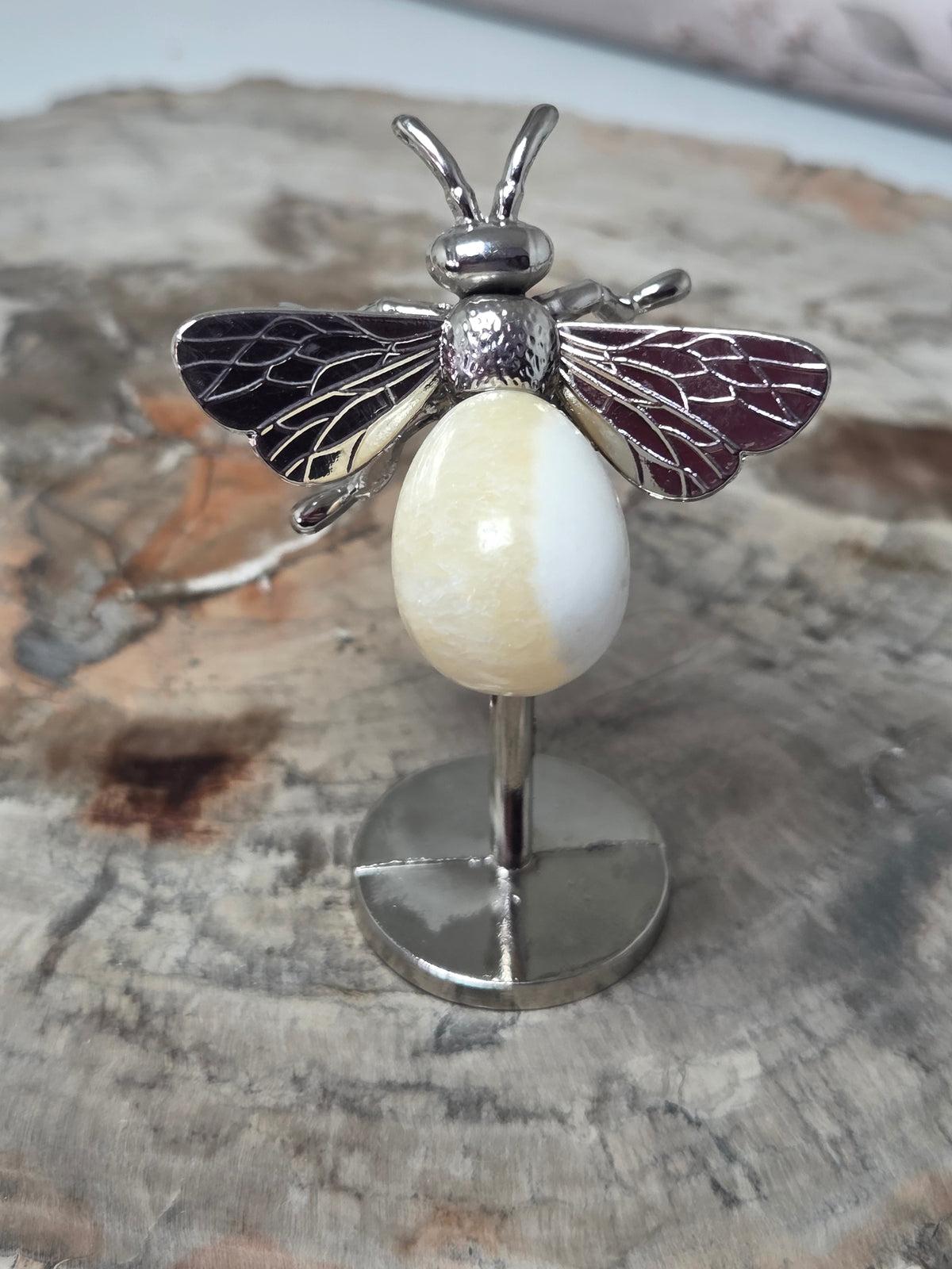 Orange calcite crystal bee carving