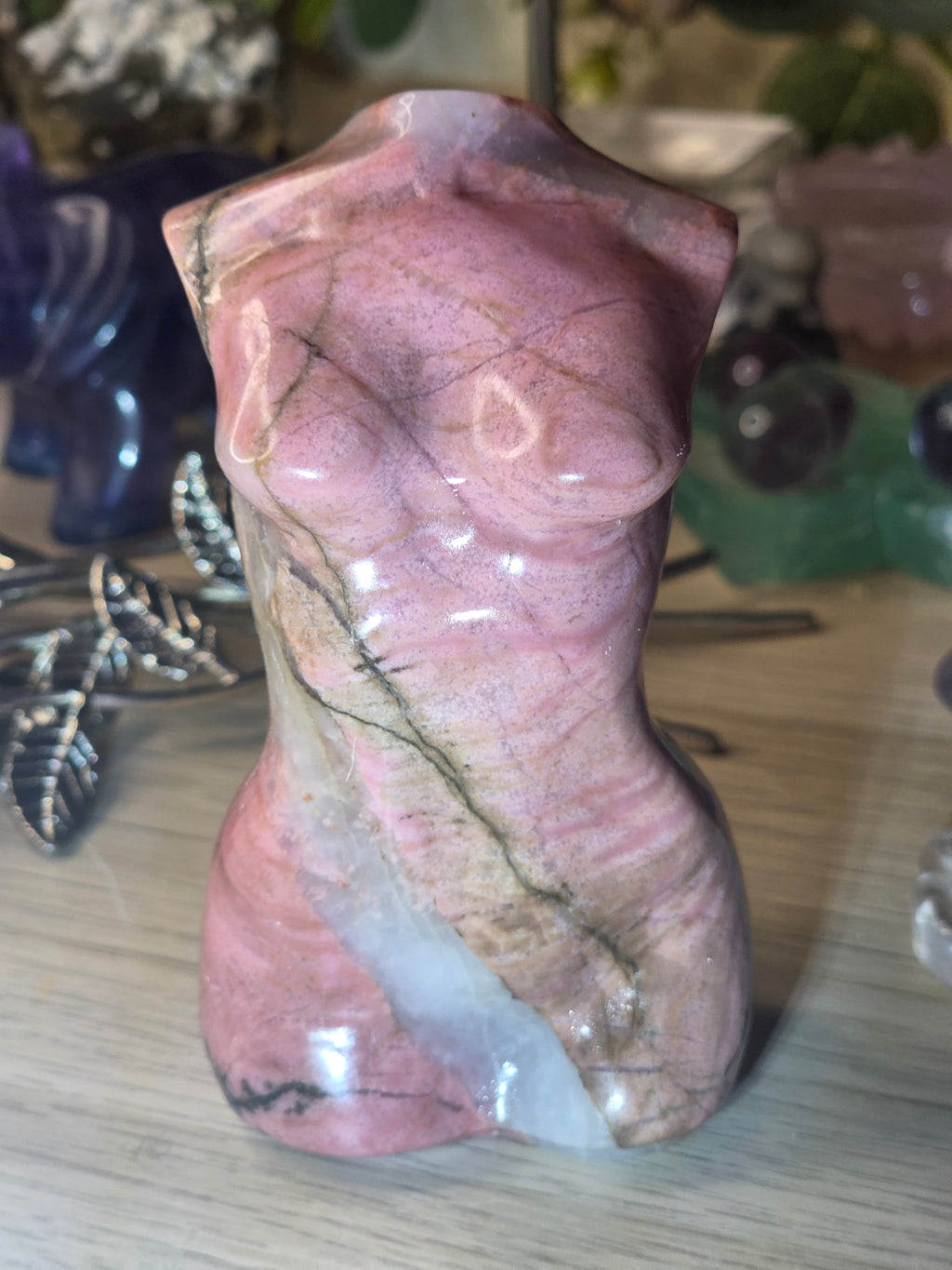 Rhodonite crystal female body carving