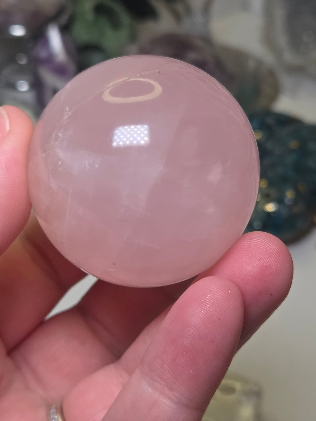 Rose quartz crystal sphere with  crack line and star flash