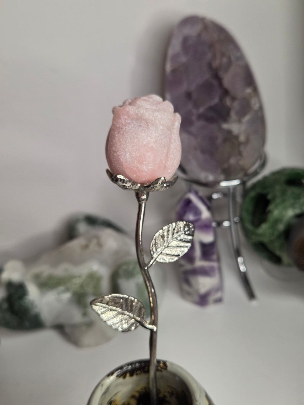 Pink opal crystal rose on stand