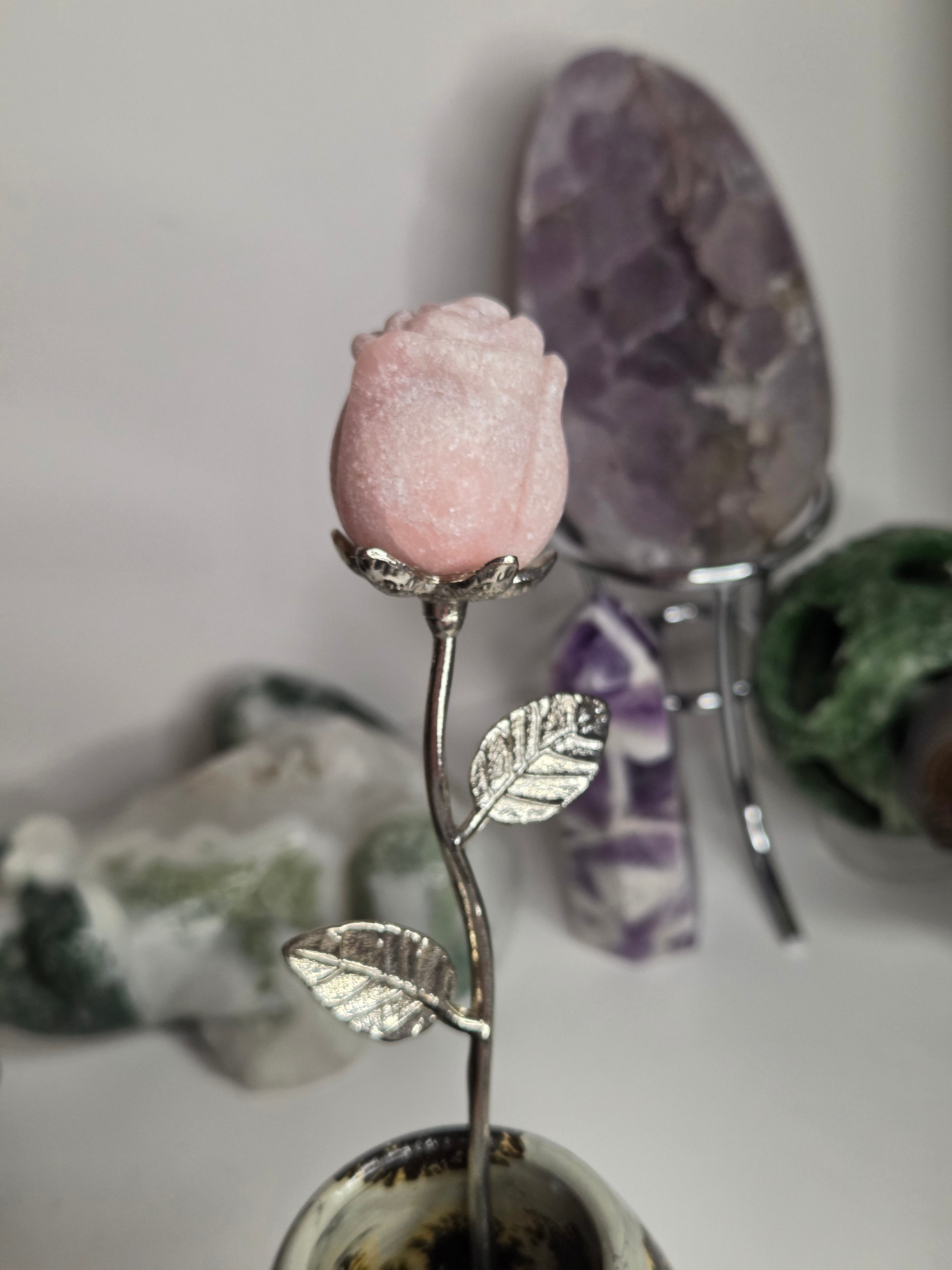 Pink opal crystal rose on stand