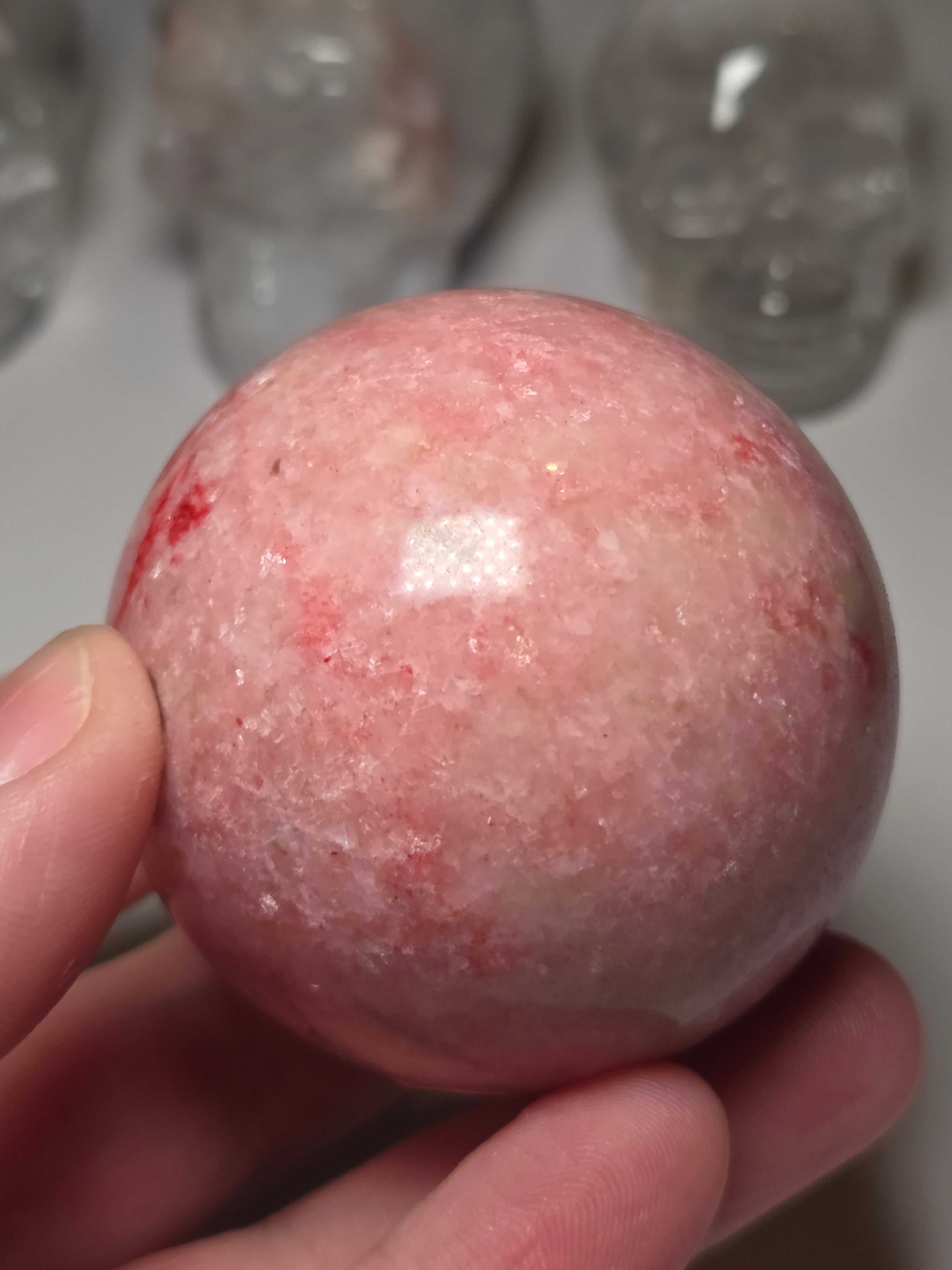 Pink zoisite crystal sphere carving with UV and comes with Stand