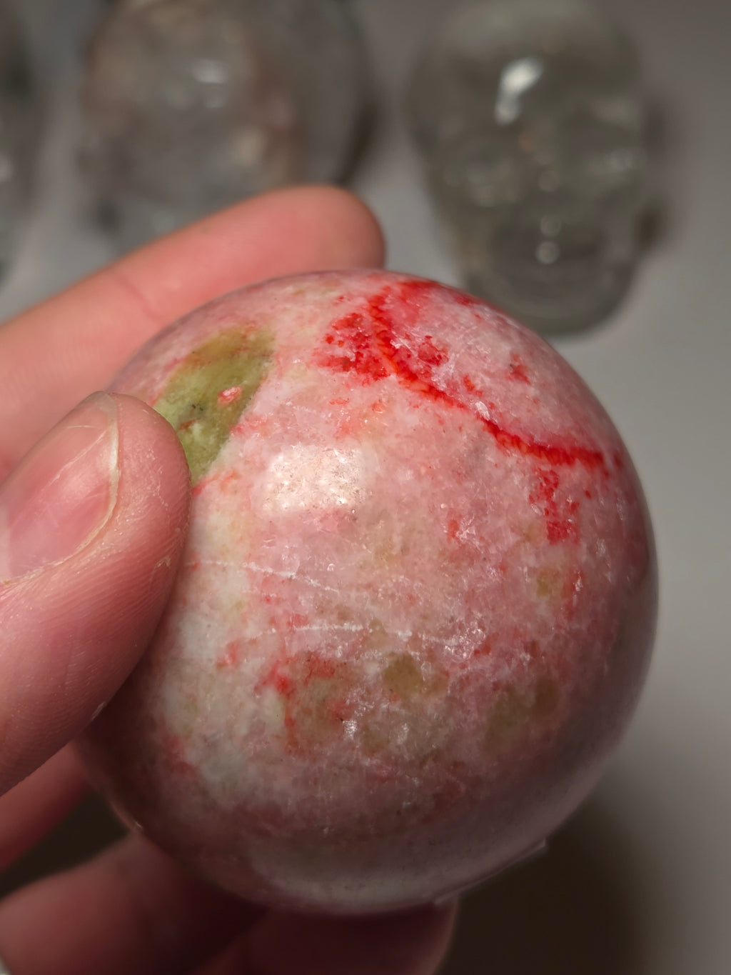 Pink zoisite crystal sphere carving with UV and comes with Stand