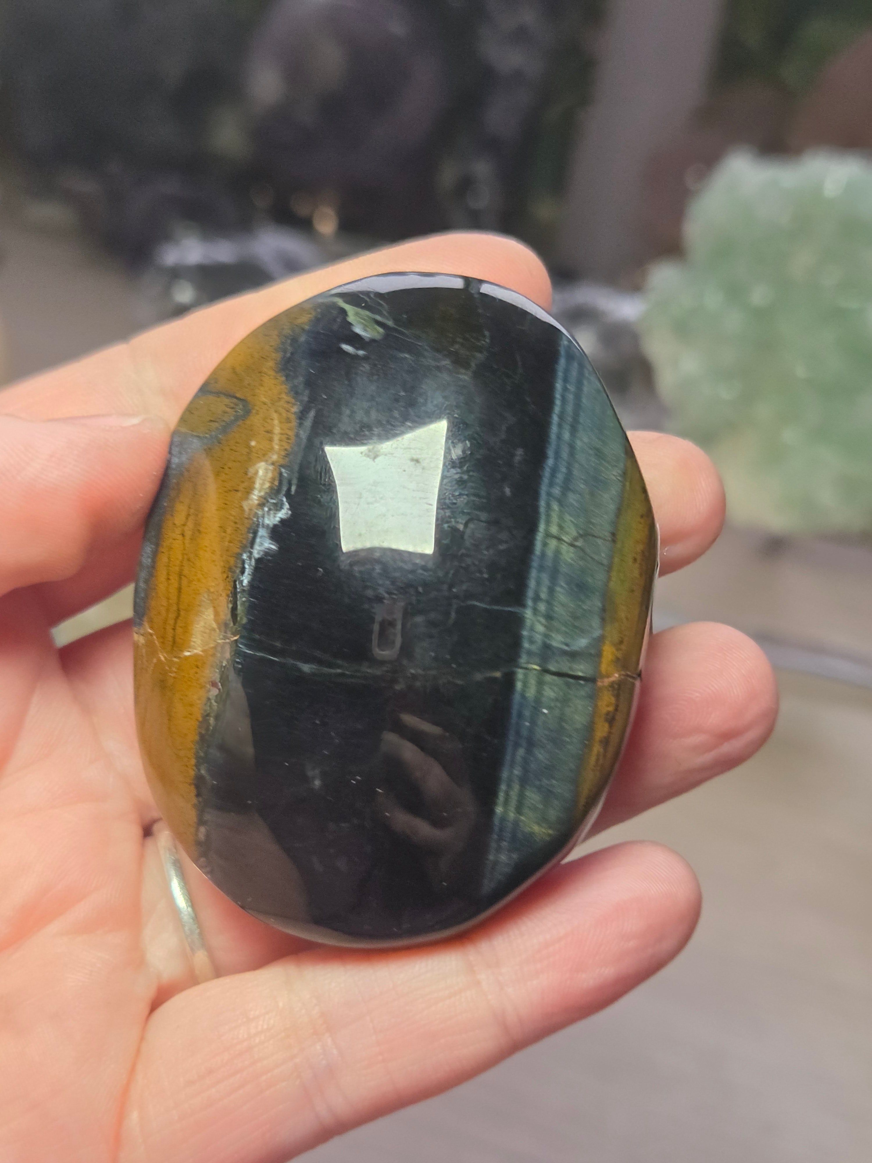 Tigers eye palm stone with Imperfections