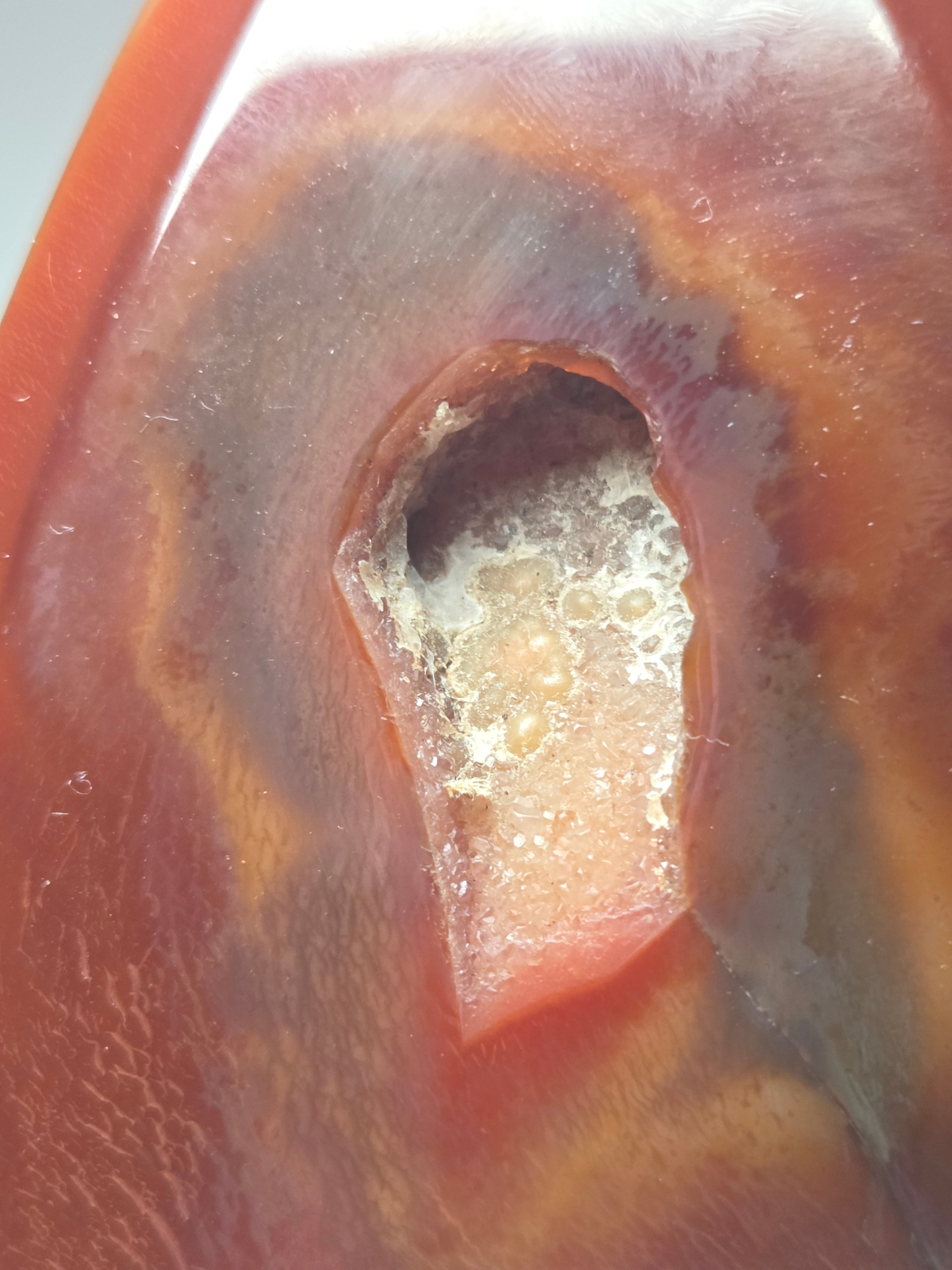 Carnelian crystal drop with imperfections