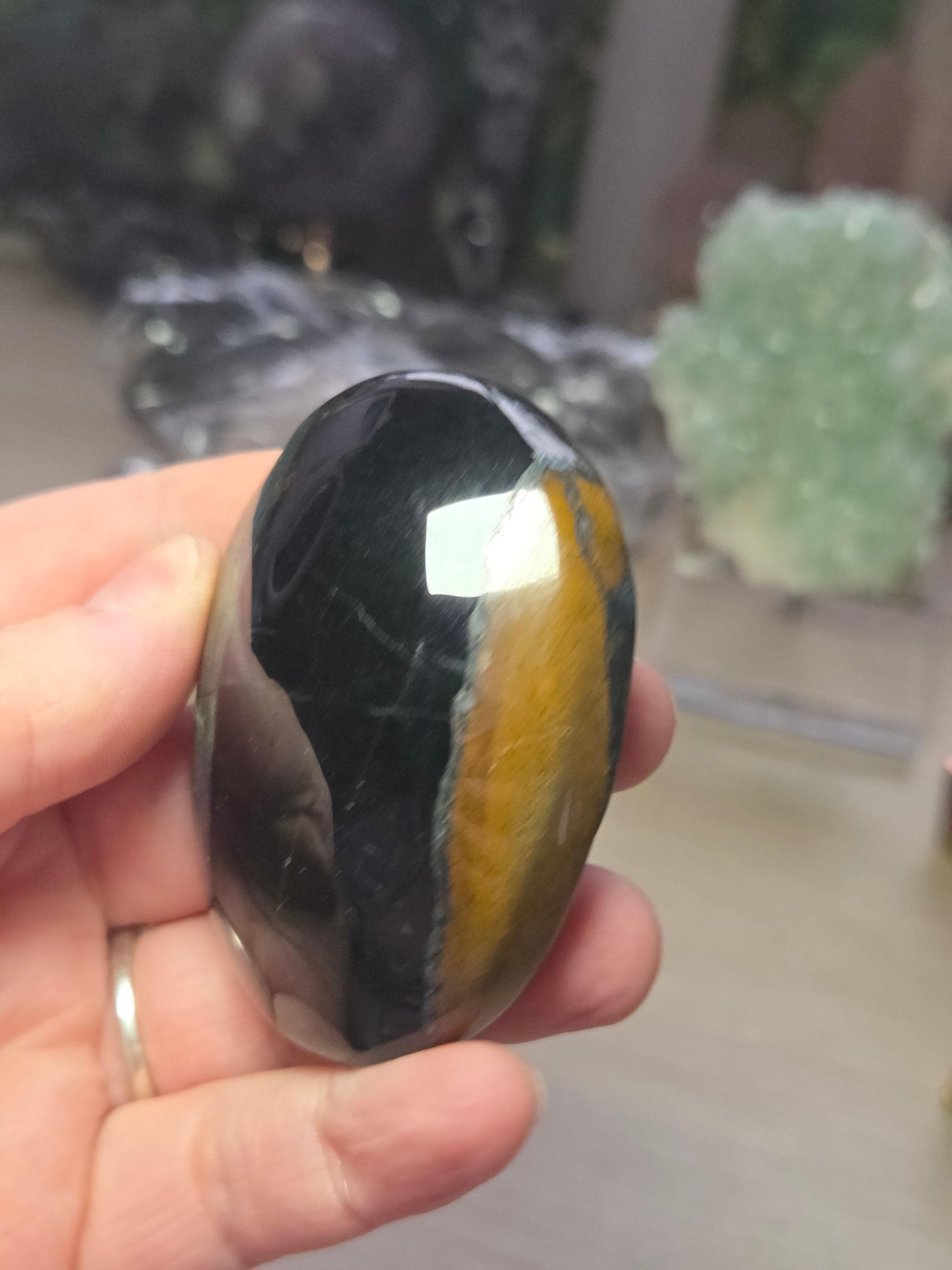 Tigers eye palm stone with Imperfections