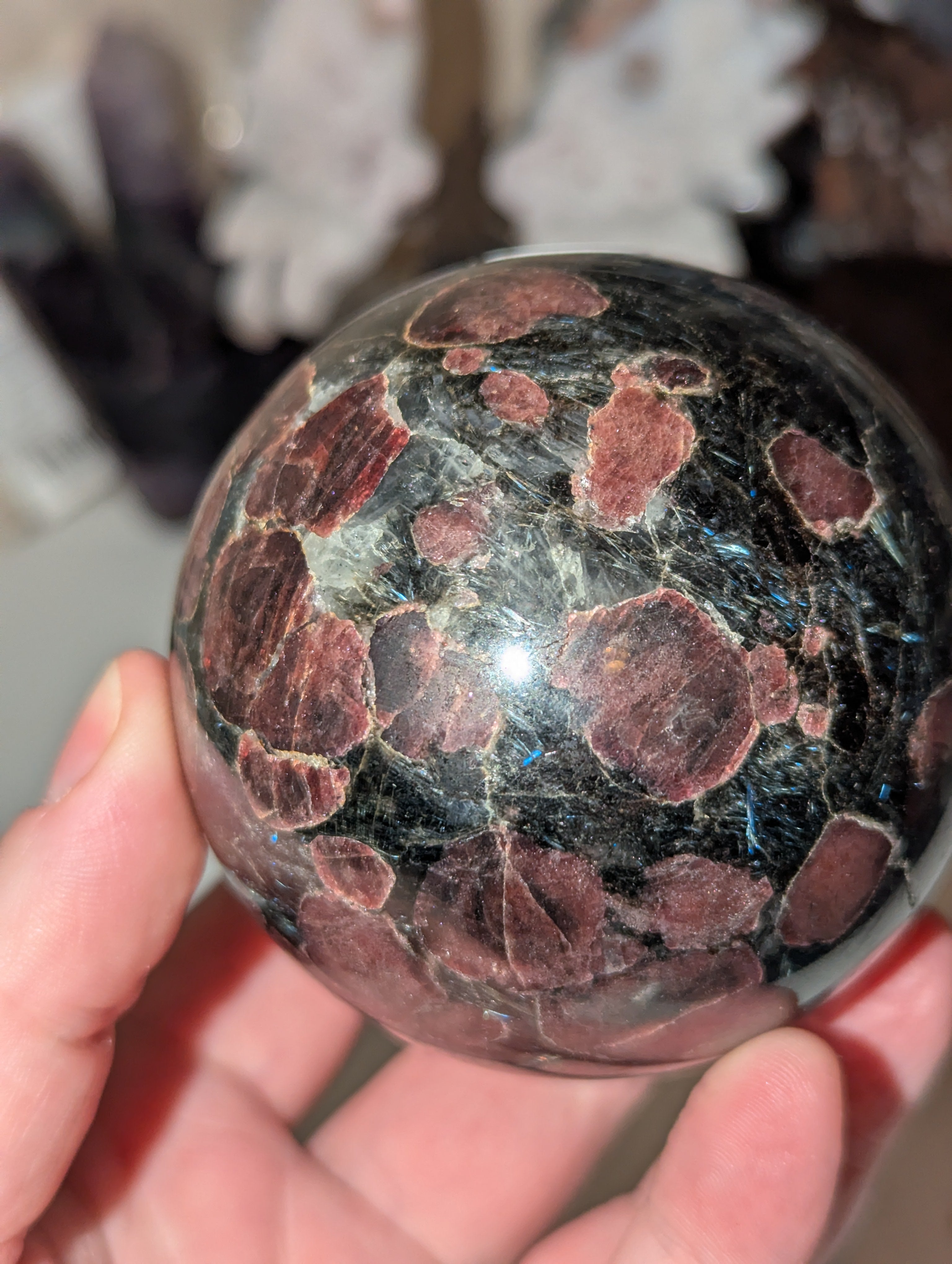Astrophylite crystal sphere with garnet