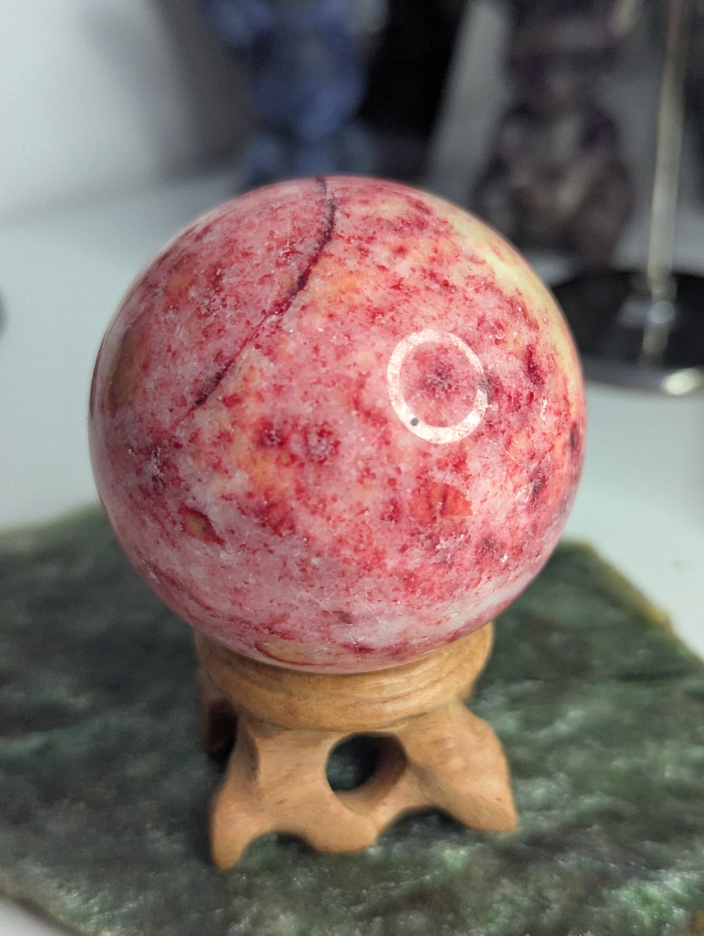Pink Zoiltie crystal sphere with Orange UV