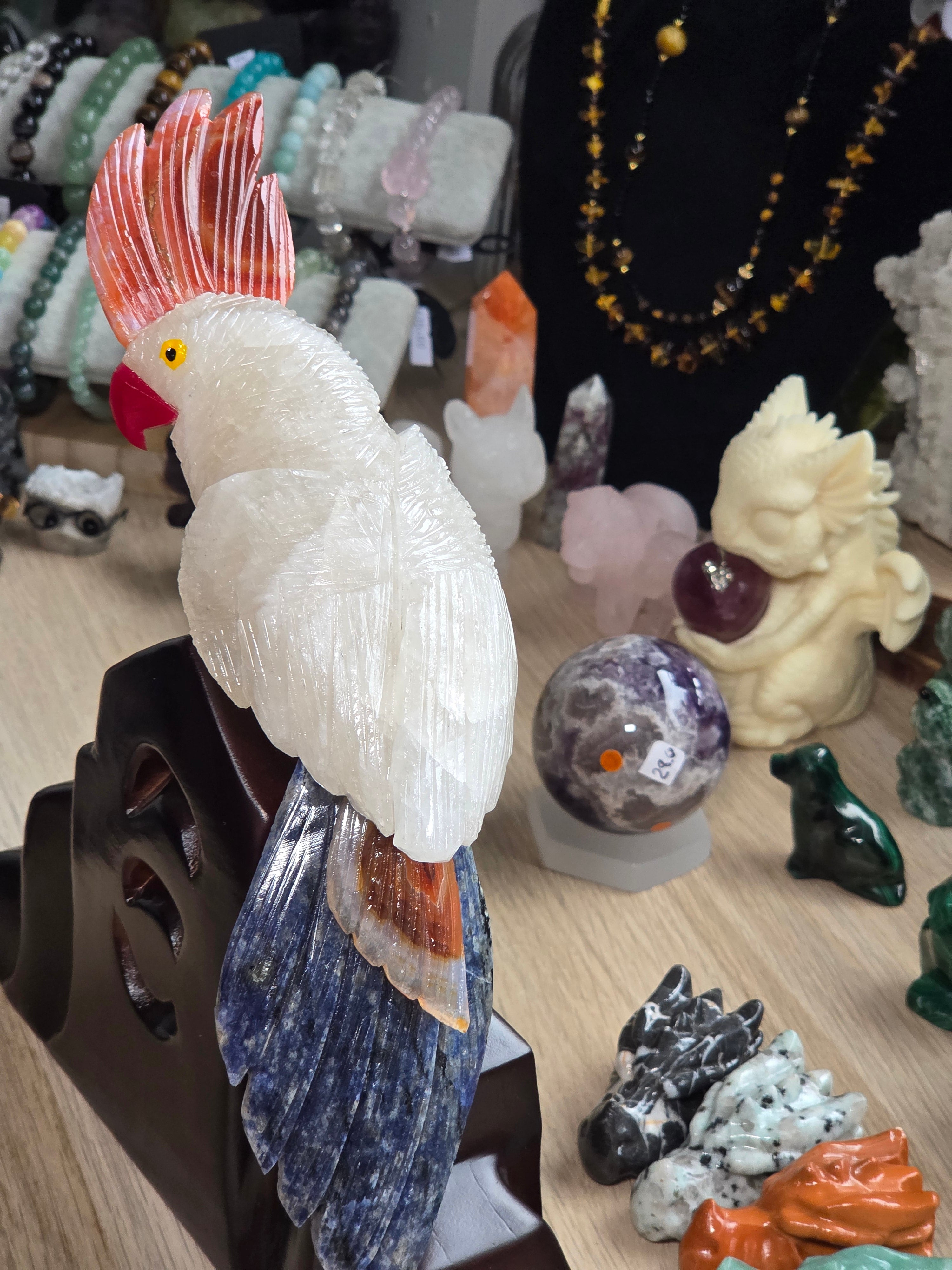 Amazing clear quartz crystal parrot with red agate and sodalite with custom stand