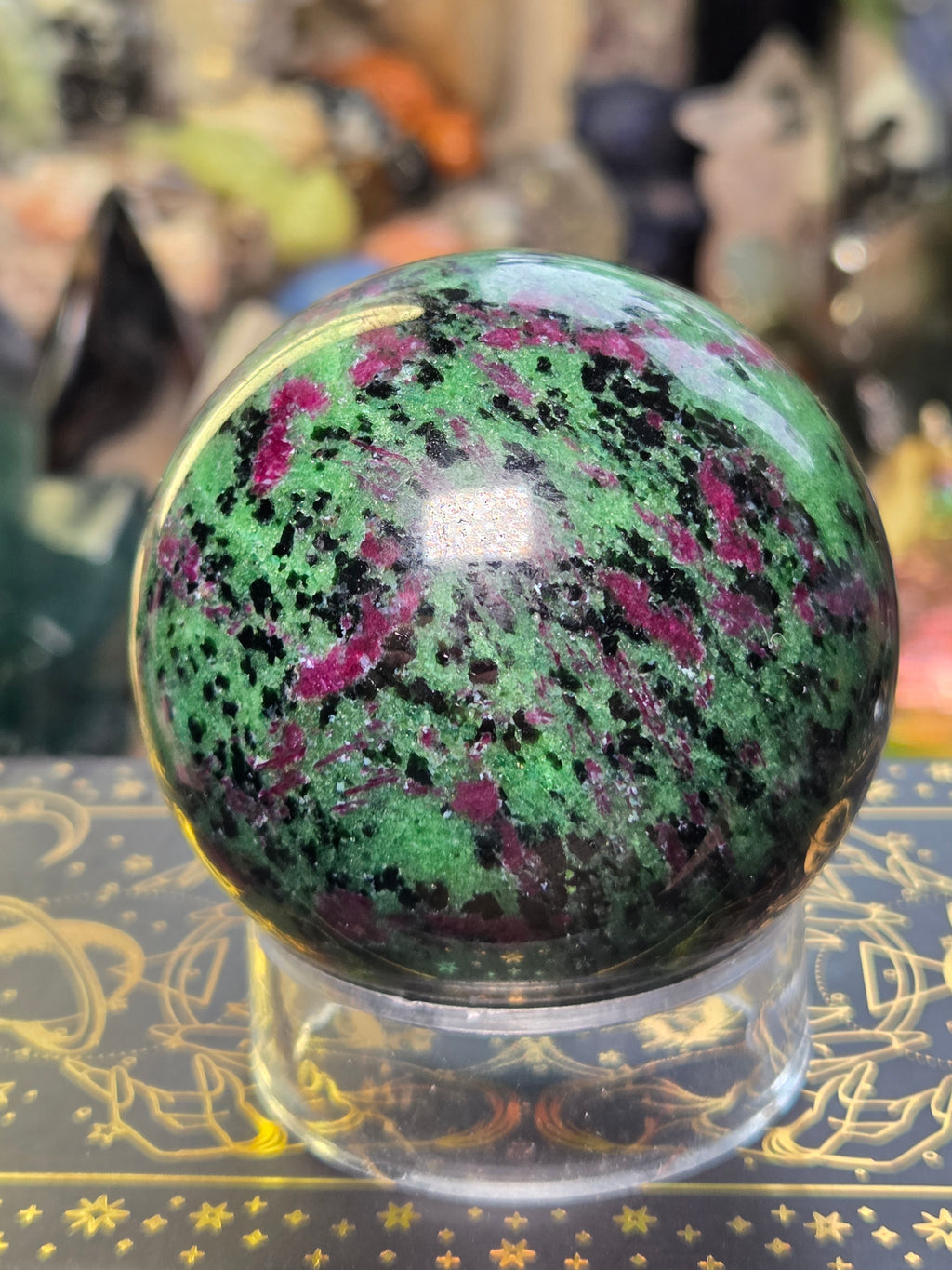 Ruby in zoisite crystal sphere carving