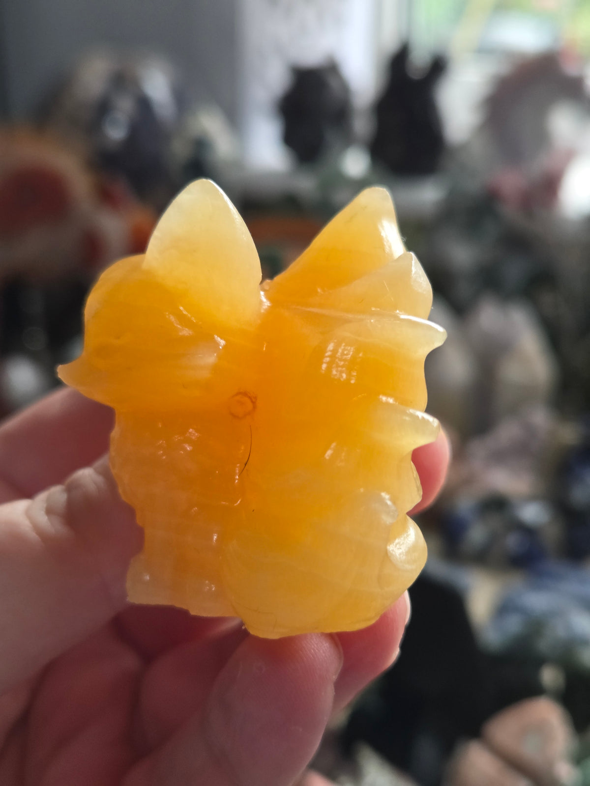 Orange calcite crystal nine tail fox