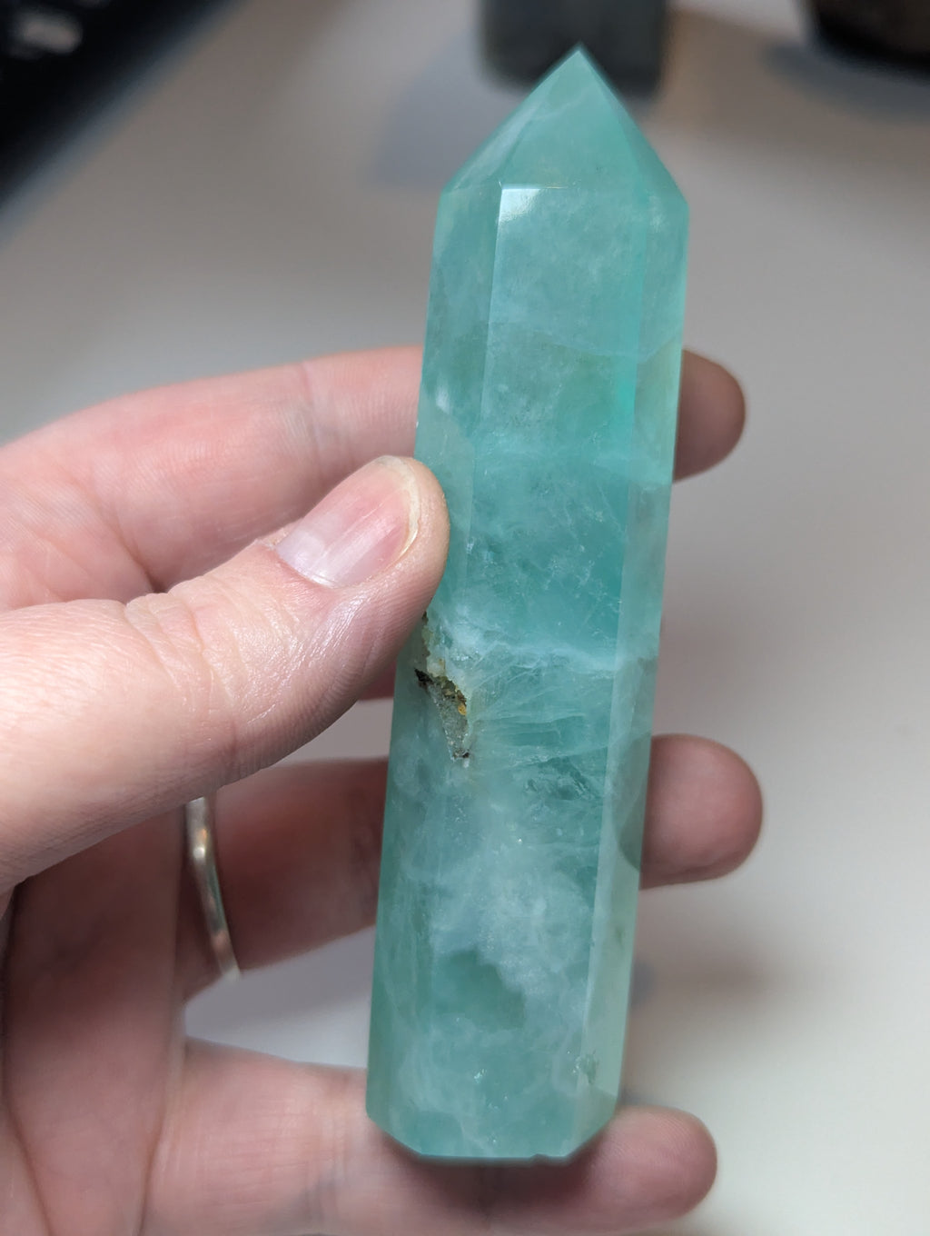 Green flouite crystal tower with imperfections