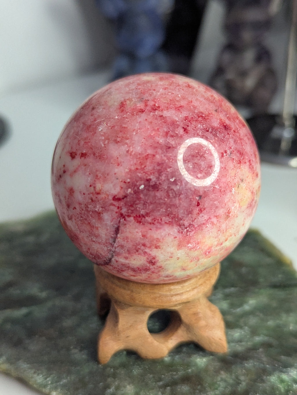 Pink Zoiltie crystal sphere with Orange UV