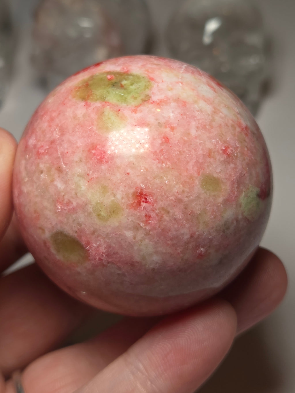 Pink zoisite crystal sphere carving with UV and comes with Stand